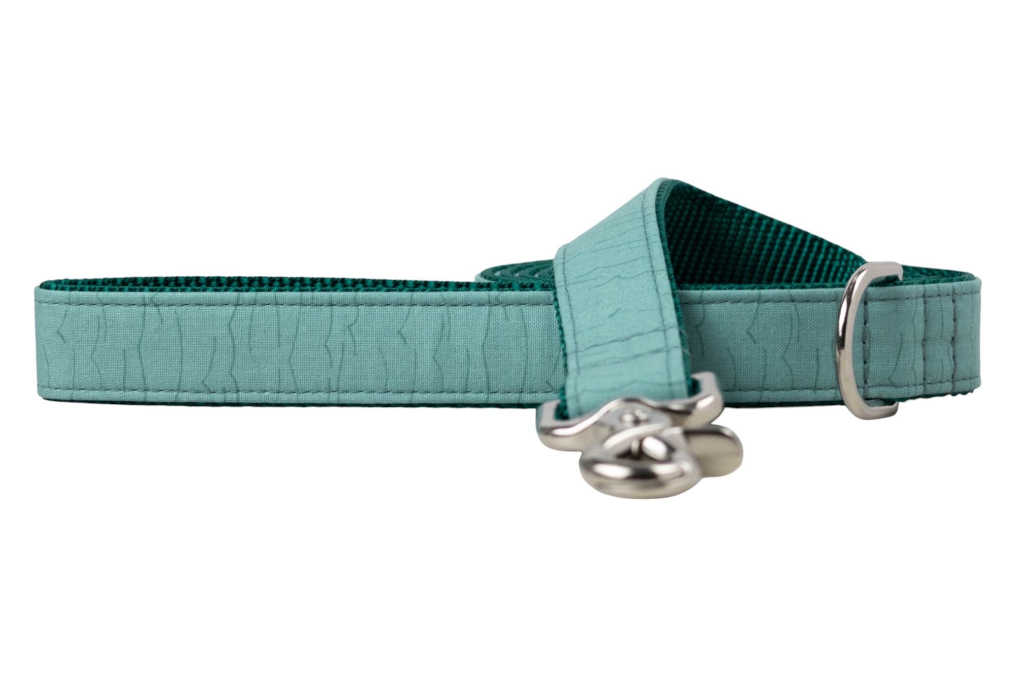 Minimalist teal dog leash featuring a rippled wave texture on the outer fabric, deep teal webbing on the inner side, and silver-tone metal fittings