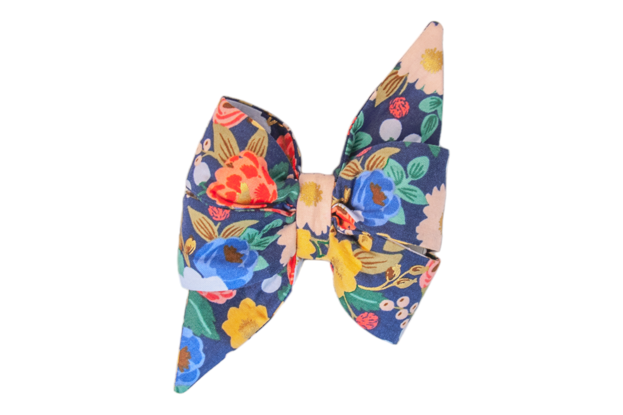 Feminine fabric dog belle bow with a bold and vibrant floral design, showcasing large roses, peonies, daisies, and leaves on a dark blue base. The belle bow has a double-layered structure with long pointed ends.