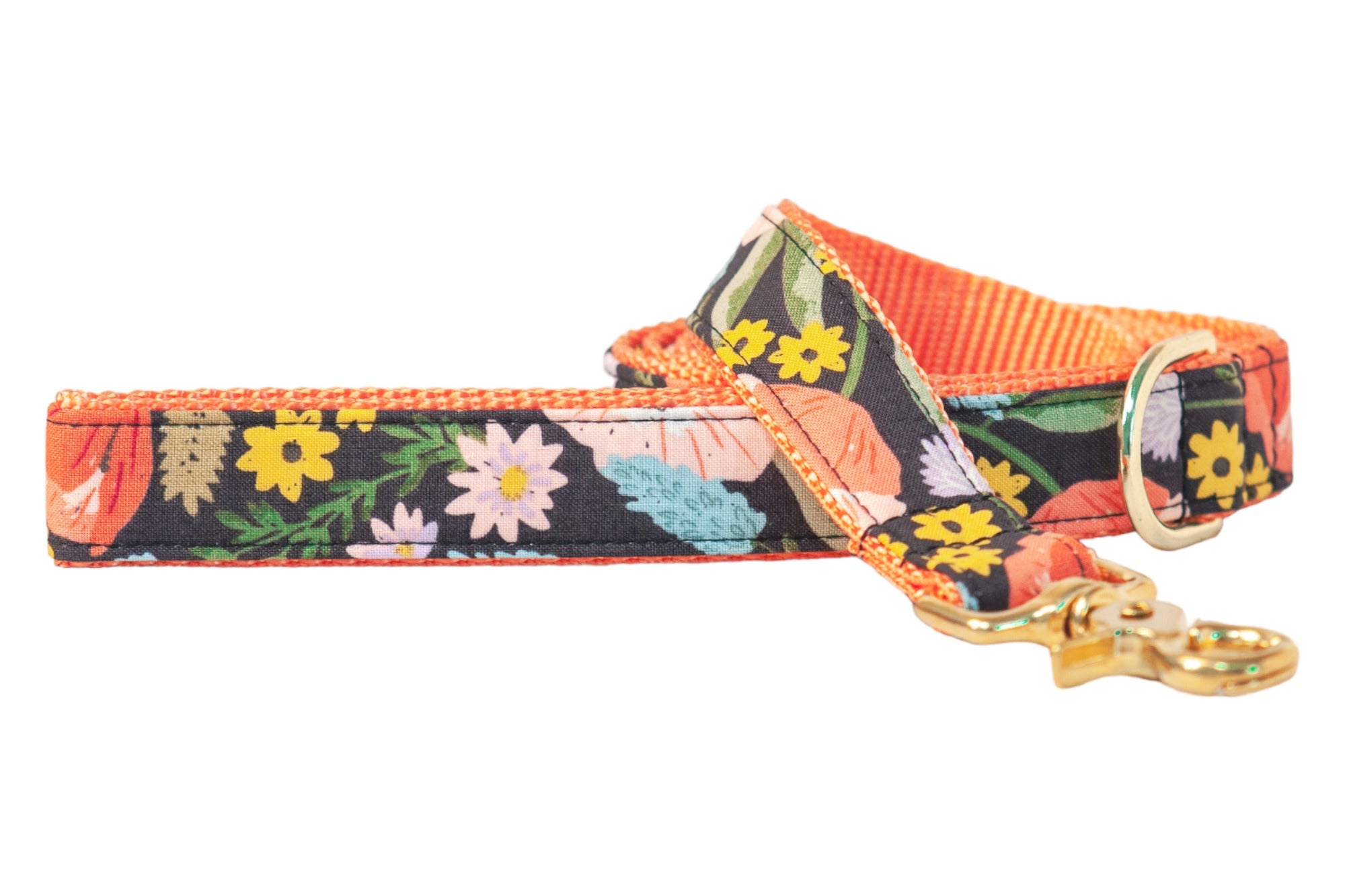 This stylish dog leash features a dark floral design with cheerful blossoms-contrasted by a bright nylon backing and polished hardware standout walks.