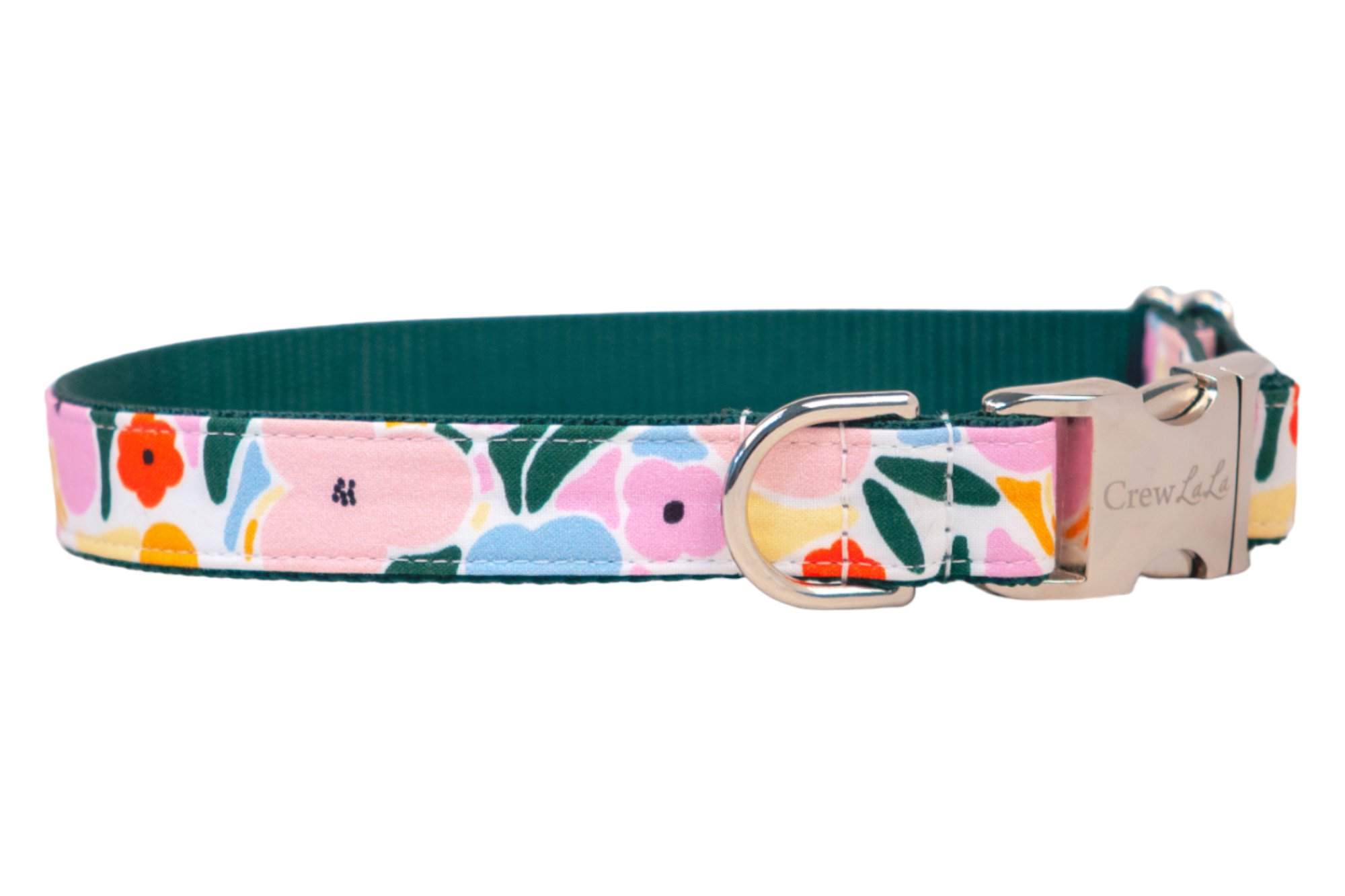 A stylish dog collar featuring a colorful floral print with pink, orange, yellow, and blue flowers and green leaves on a white background. The collar has a dark green inner lining and is finished with a shiny silver metal buckle and D-ring. The brand name “Crewlala” is engraved on the buckle.