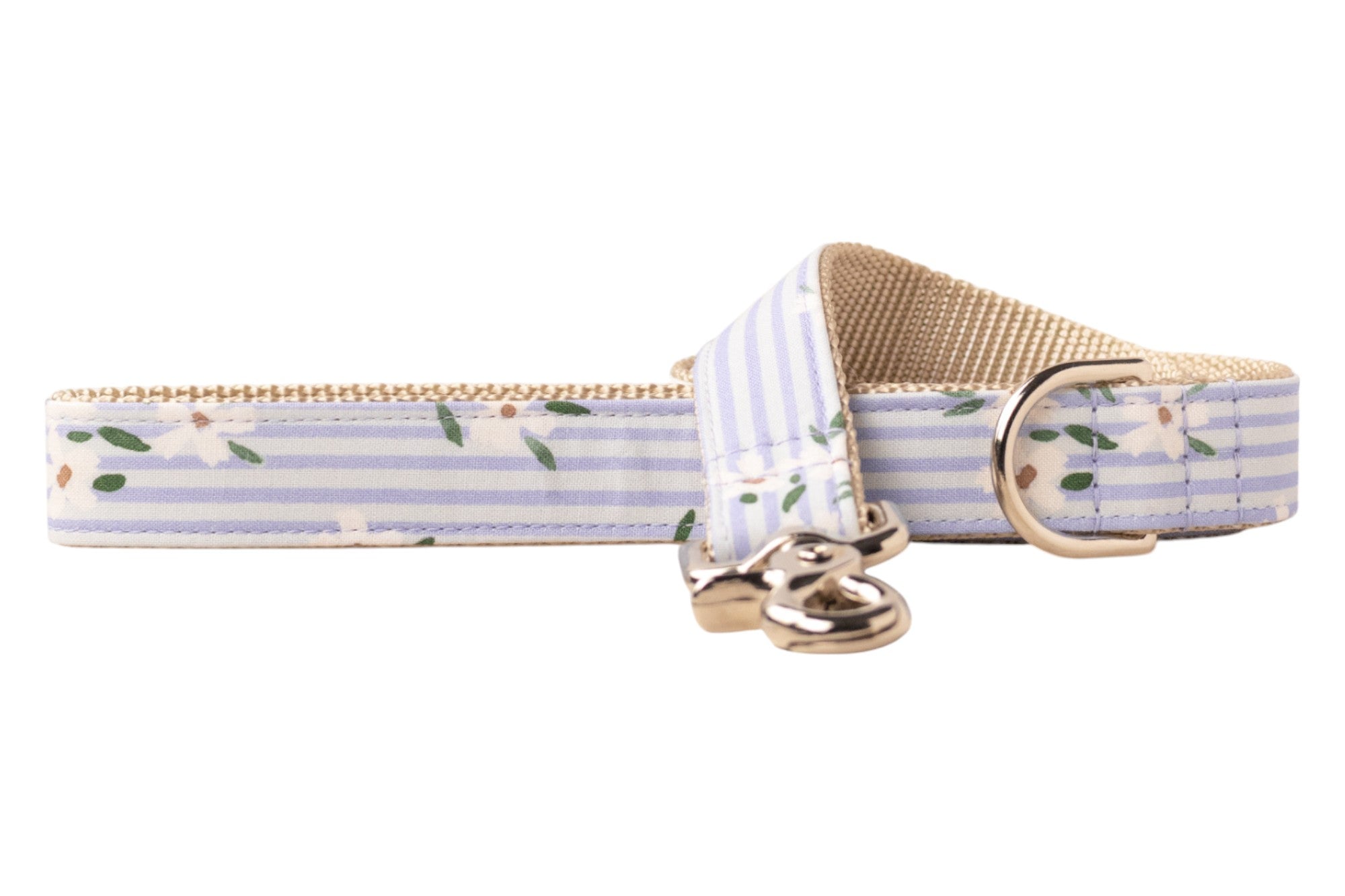 Striped dog collar with pastel blue and white horizontal lines, decorated with a floral design. The collar includes beige webbing on the inner side and shiny gold metal hardware.