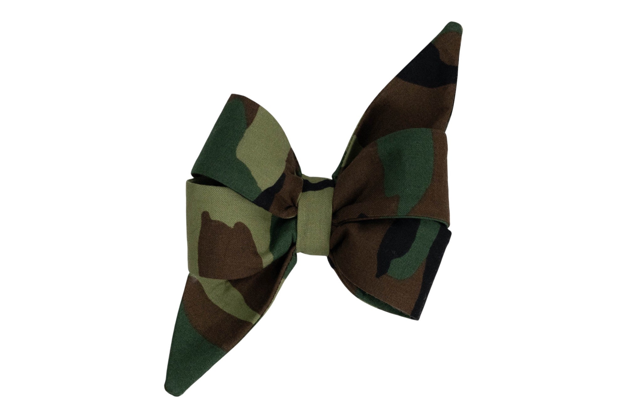 A large fabric bow in green, brown, and black camouflage print, with wide loops and pointed tails.