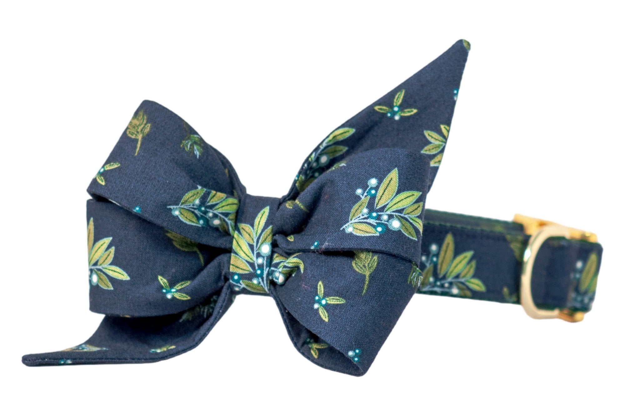 Navy blue dog collar with a large, pointed-edge feminine fabric belle bow, featuring a botanical print of leaves and clusters of pale berries, accented with metal hardware.