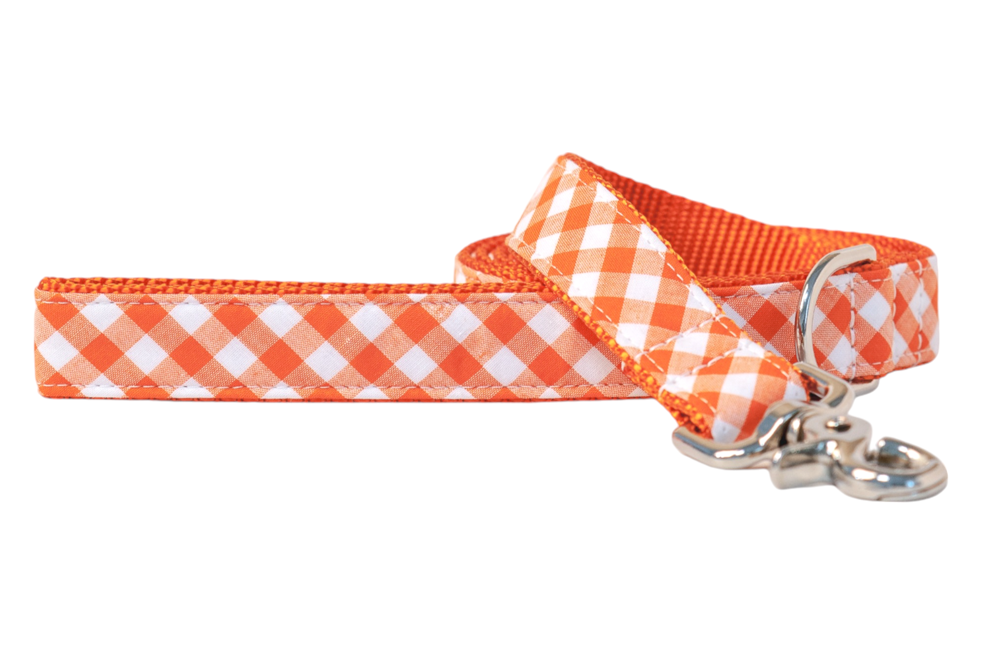 Orange plaid dog leash with just the right amount of flair. Whether your pup’s chasing squirrels or just the spotlight, this leash keeps walks cute, comfy, and totally on trend.