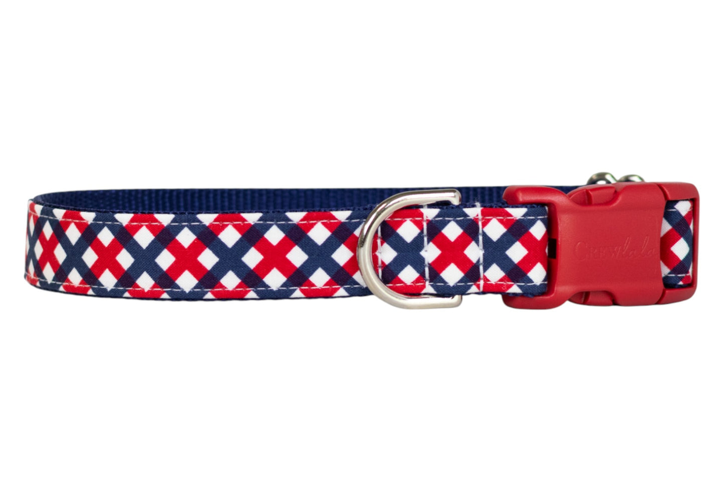 Close-up of a dog collar with a bold red, white, and navy blue patriotic plaid design, complete with a silver metal D-ring and red buckle.