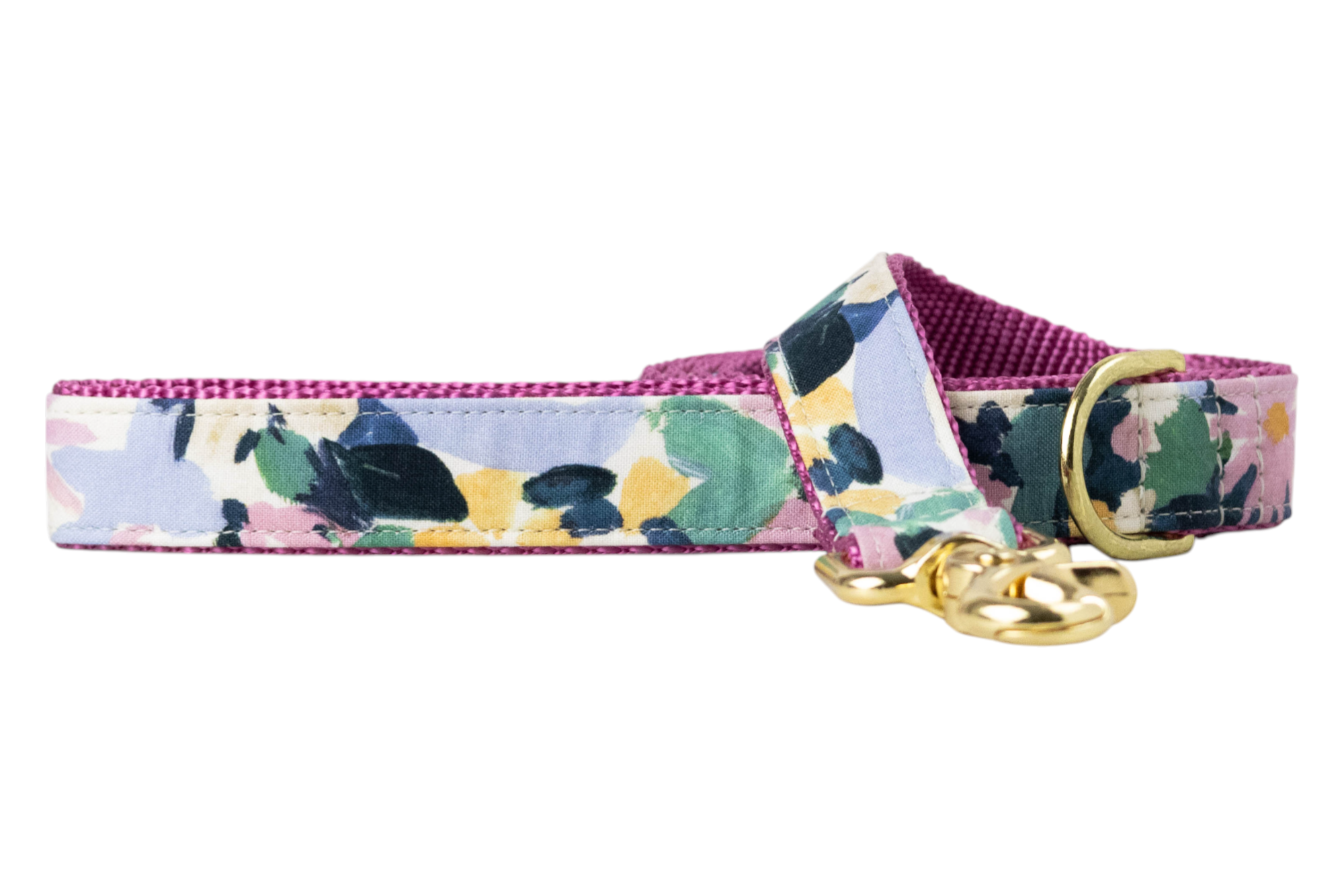 A floral dog leash made from durable nylon with a soft colorful floral print overlay. Includes reinforced stitching and a metal swivel clasp for secure attachment.