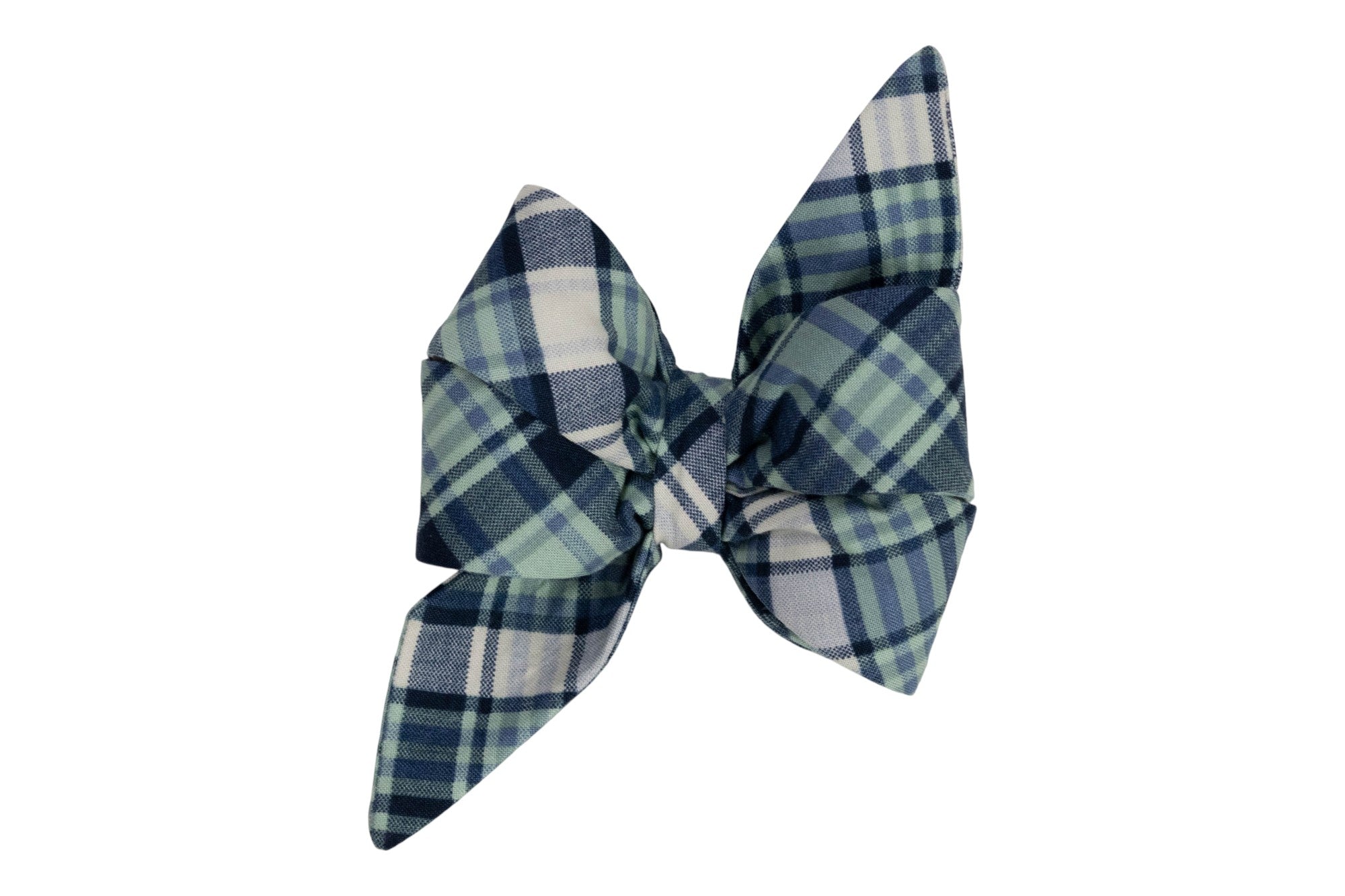 Feminine belle-style dog bow made from soft plaid fabric in navy, green, and cream tones, featuring full loops and long, pointed tails for an elegant look.