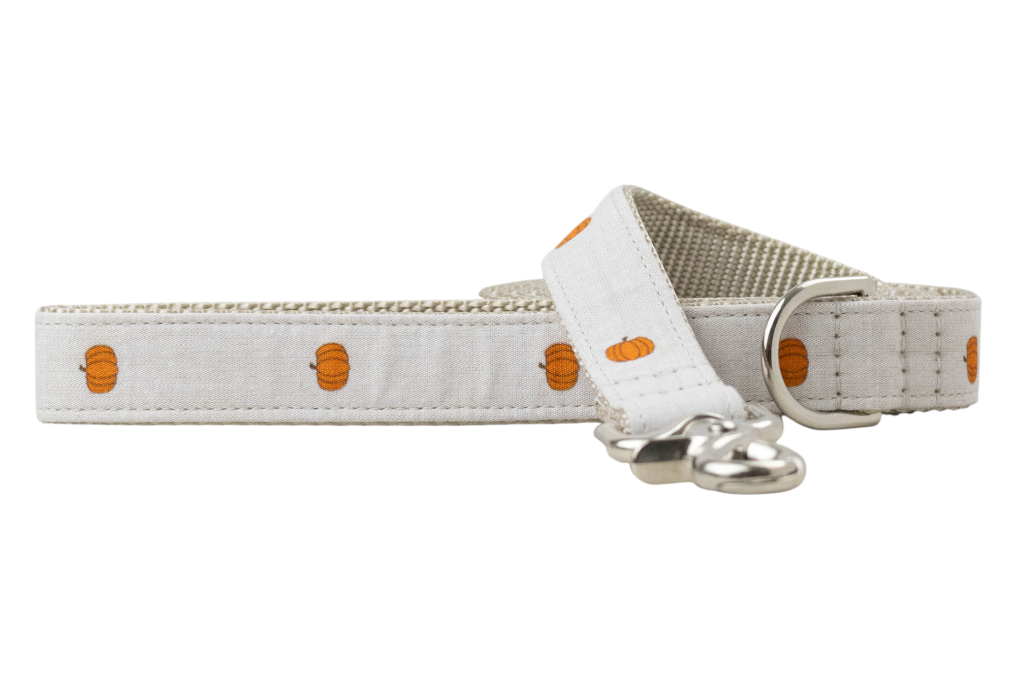 Light beige dog leash featuring a minimalist pattern of small pumpkins spaced evenly along the fabric. The leash includes a durable woven inner lining, reinforced stitching, a swivel clasp, and a matching D-ring near the handle. A subtle and stylish option for autumn or Halloween walks.