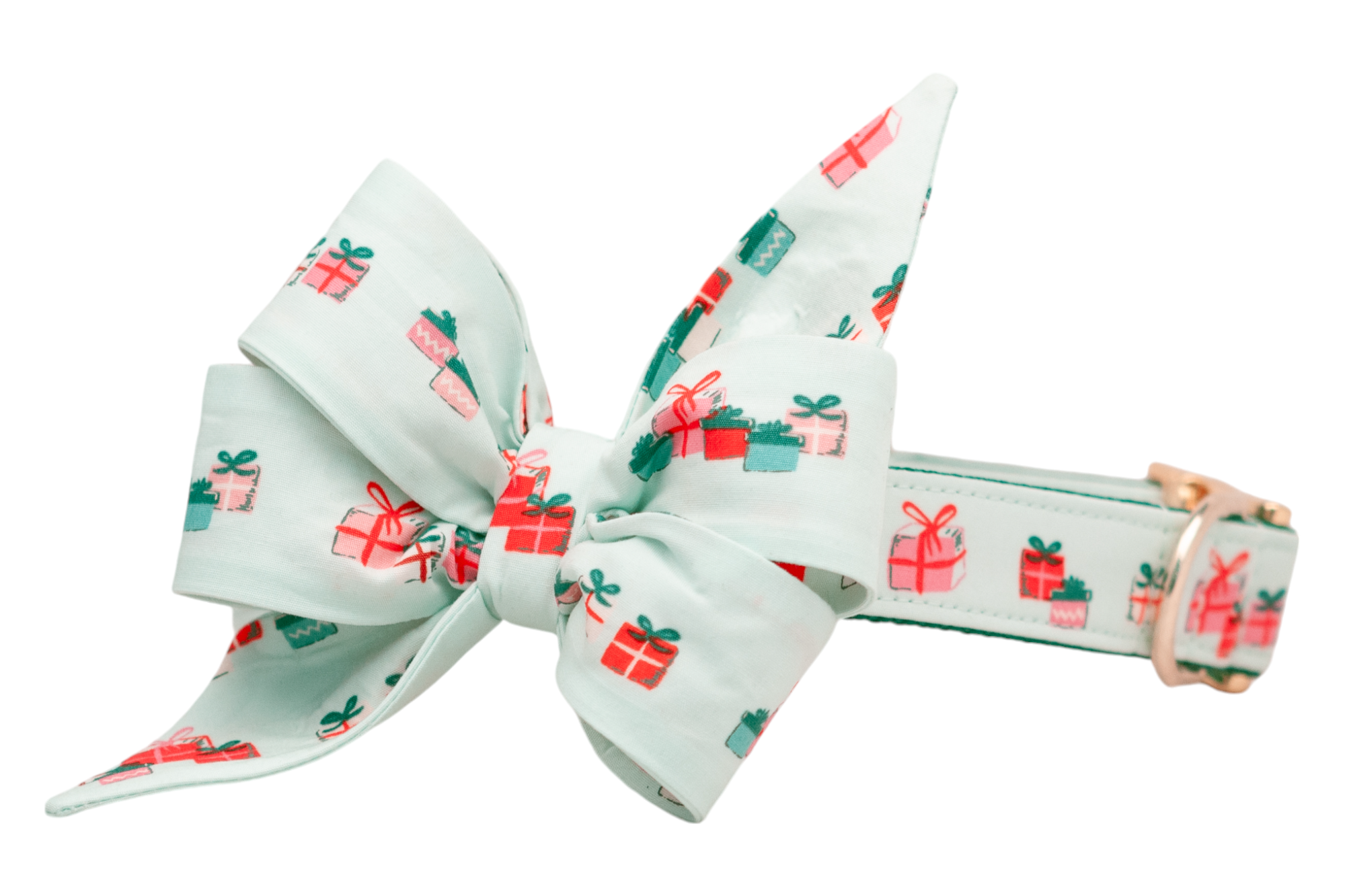 Holiday-themed dog collar in light green, paired with a dramatic, oversized matching belle bow that includes two structured loops and pointed tails. The fabric has small colorful presents, and the collar is finished with polished metal accents.