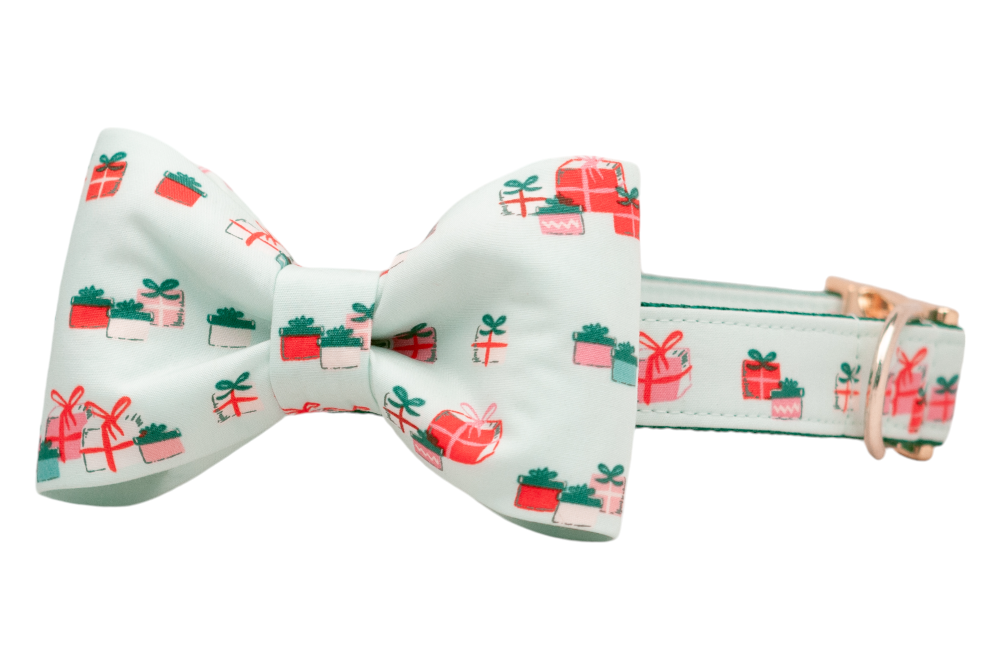 A festive dog collar with an attached matching bow tie, both made from green fabric printed with colorful holiday gift boxes. The structured bow tie is centered on the collar, which features polished hardware including a metal buckle and D-ring.