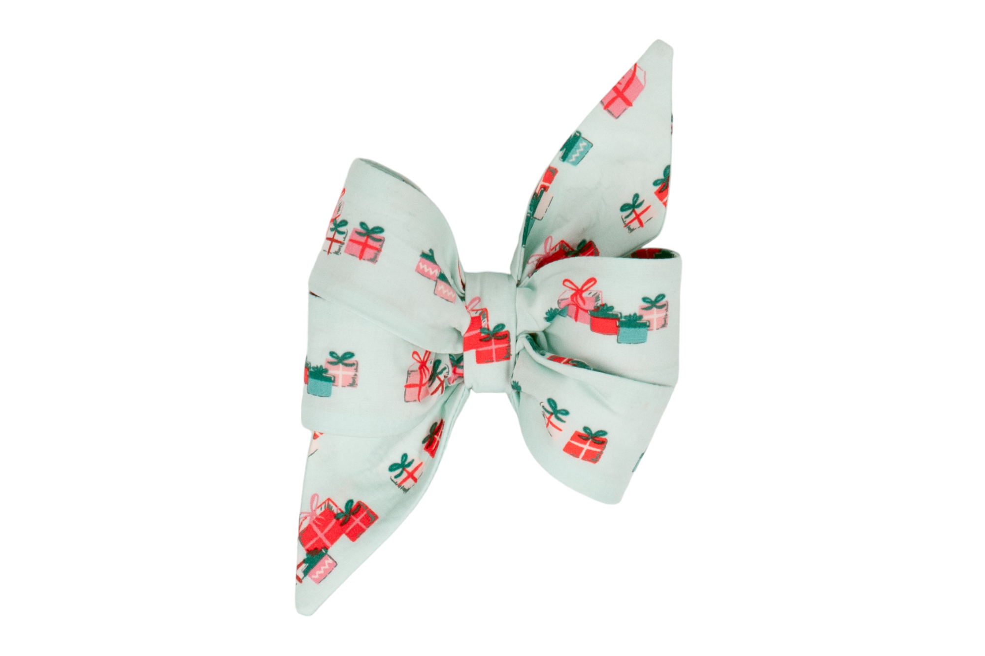 Holiday-themed dog accessory featuring a classic belle bow with long tails in a pale green shade. The fabric is decorated with brightly colored gift illustrations, giving the feminine belle bow a festive, polished appearance perfect for seasonal photos or events.