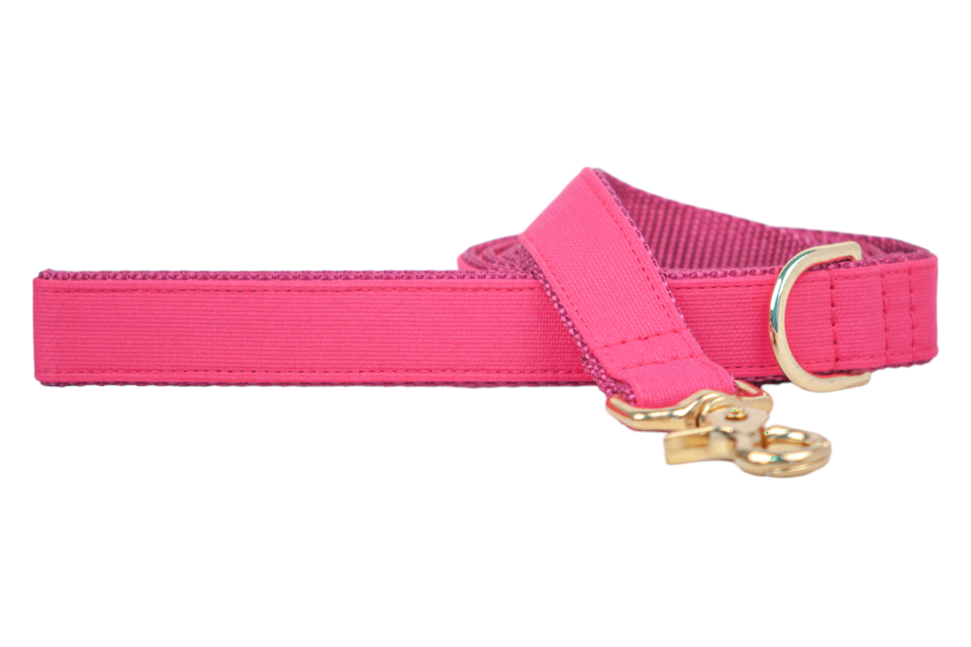 Vibrant pink dog leash with a sleek, structured design and luxe gold hardware. Made with a dual-layer construction for durability and comfort, ideal for everyday walks or special occasions.