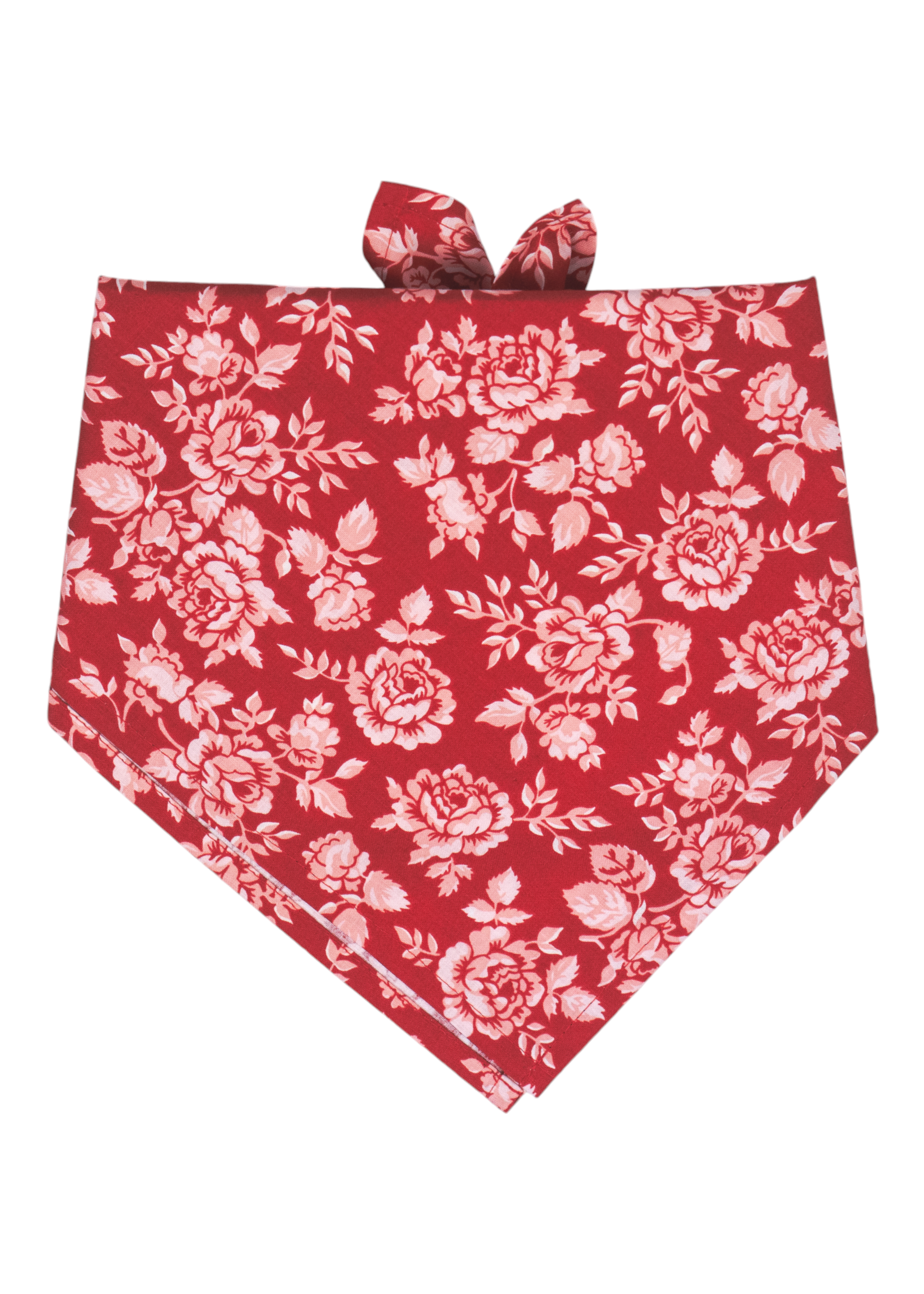 Dog bandana with a vivid red background and all-over light floral print. The fabric is tied at the top, showcasing a classic and feminine design ideal for stylish pets. Handmade in Charleston, SC.