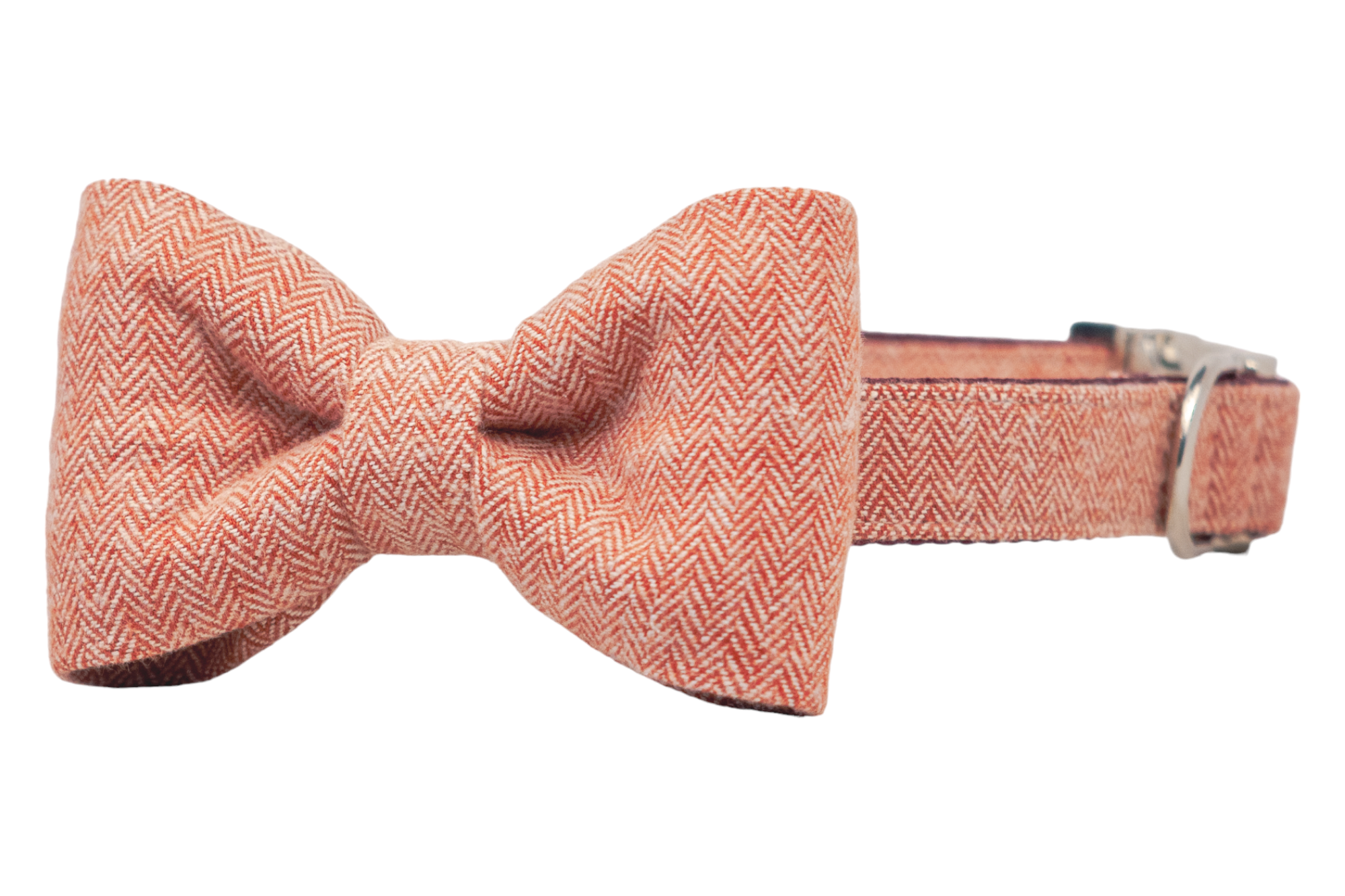 Adjustable dog collar in red herringbone fabric, featuring a large matching bow tie with structured loops, and fitted with hardware for fastening and leash attachment.