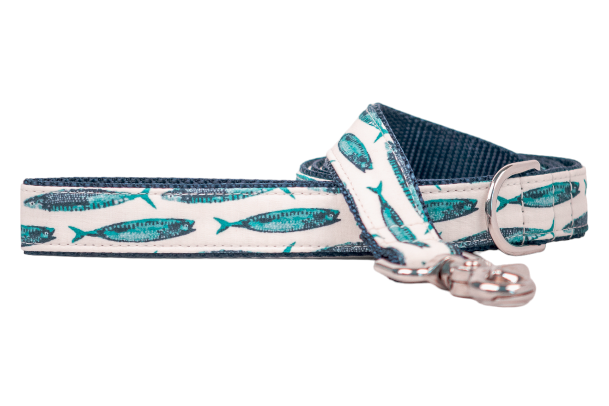 Coastal-inspired dog leash with turquoise and dark blue fish prints on a cream-colored canvas, finished with a sturdy silver clasp and navy lining.