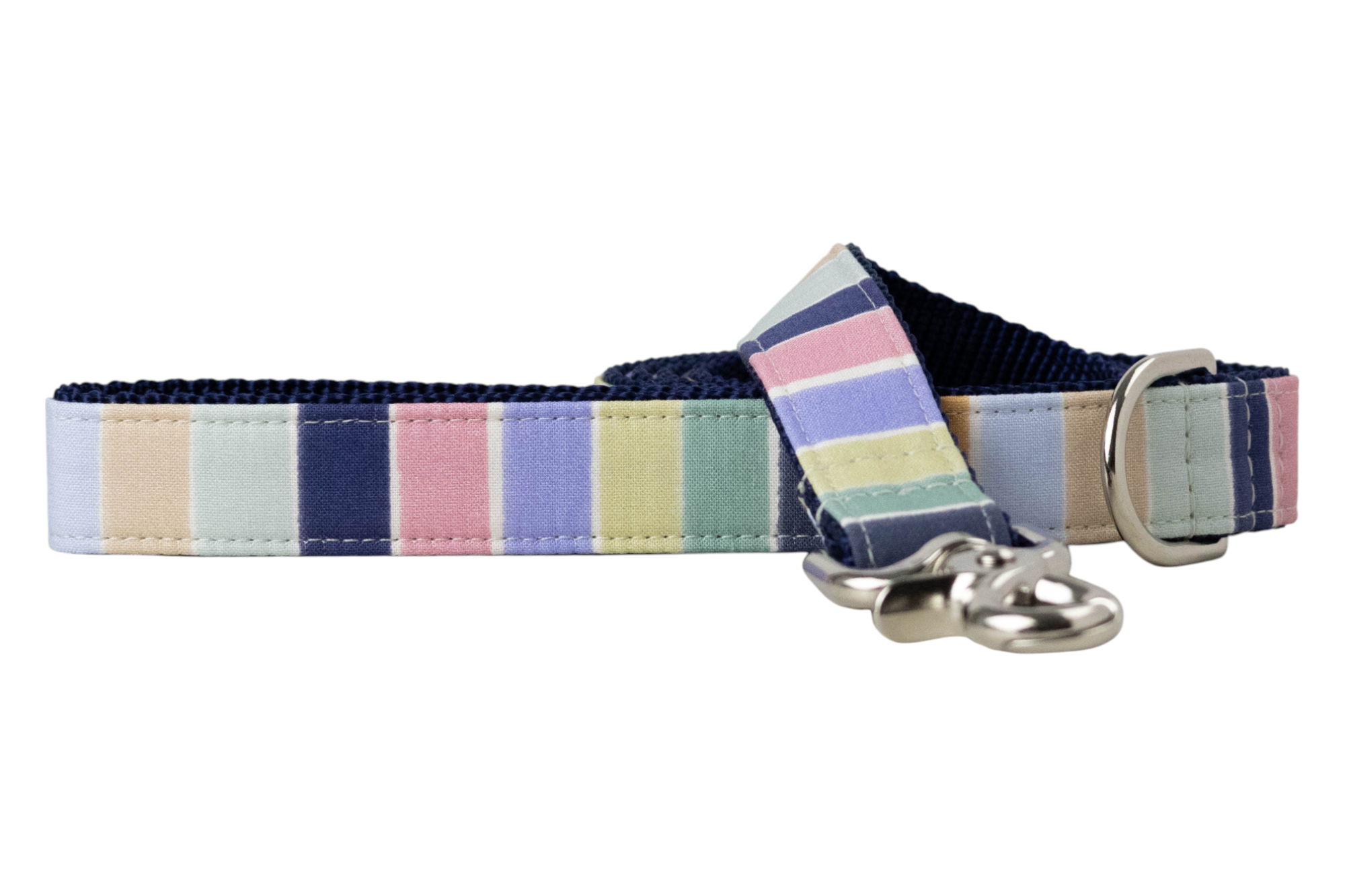 A dog leash with vertical pastel stripes and is backed with dark woven nylon. iIt ncludes a metal clasp and D-ring.