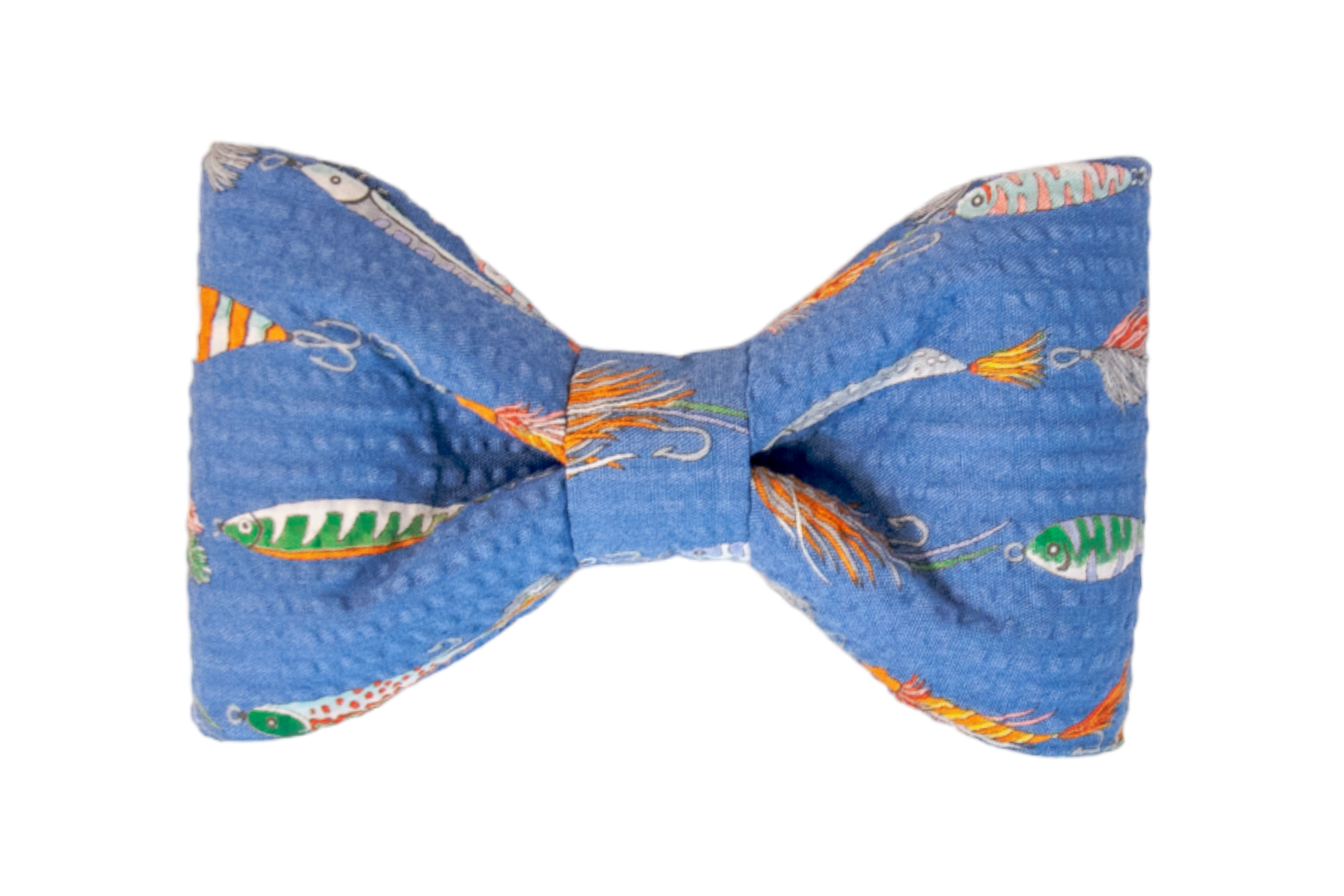 Close-up of a dog bow tie in textured blue fabric printed with an array of whimsical fishing lures and tackle, showcasing fine-line details in bright colors. The bow tie is symmetrically formed and designed to attach to a dog collar.