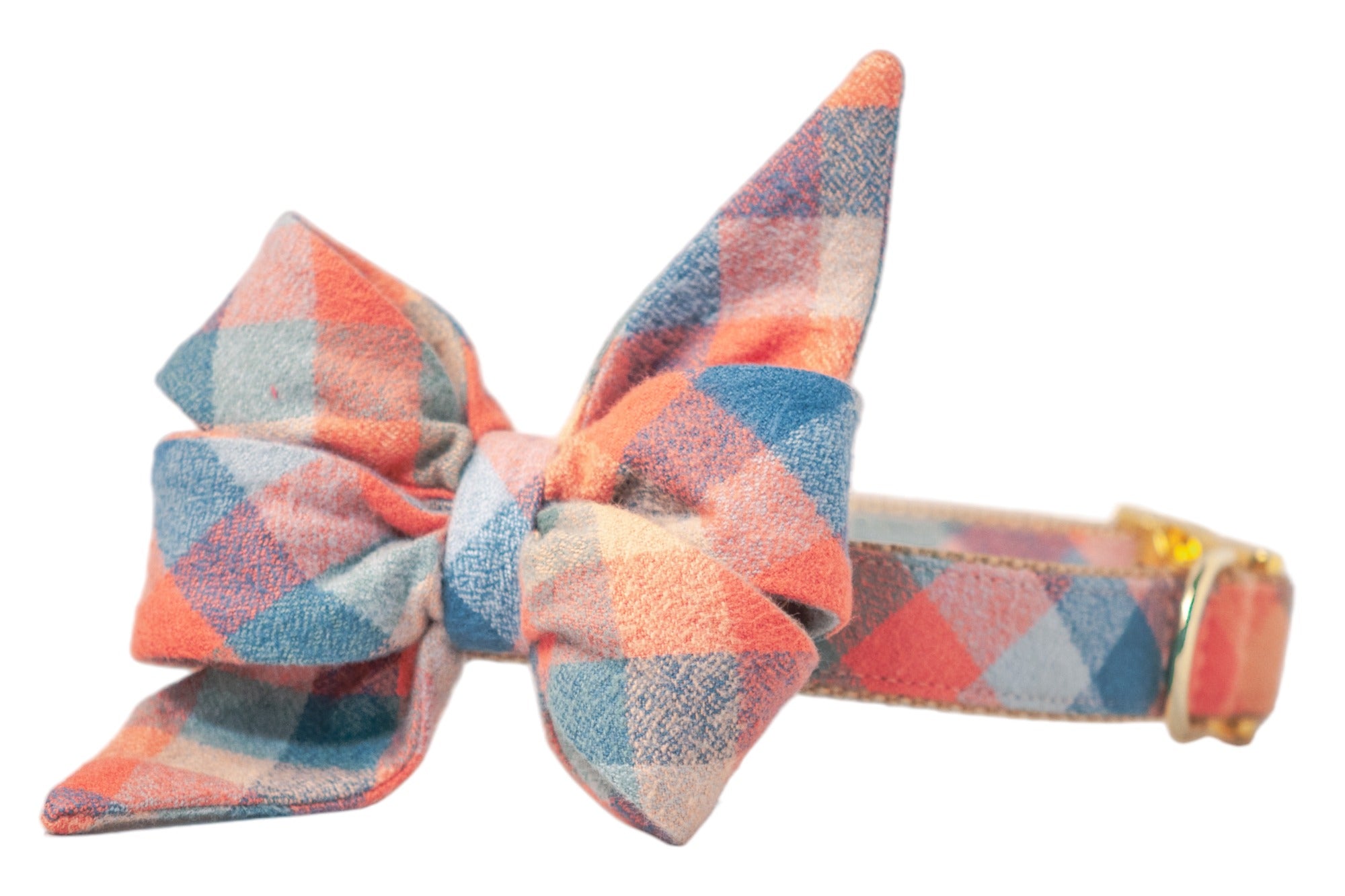 Close-up of a dog collar with a voluminous plaid bow in muted fall tones, crafted from soft flannel. The belle bow has two tall, pointed loops and two shorter angled loops for a layered effect. The matching plaid-covered collar includes an adjustable metal buckle and d-ring.