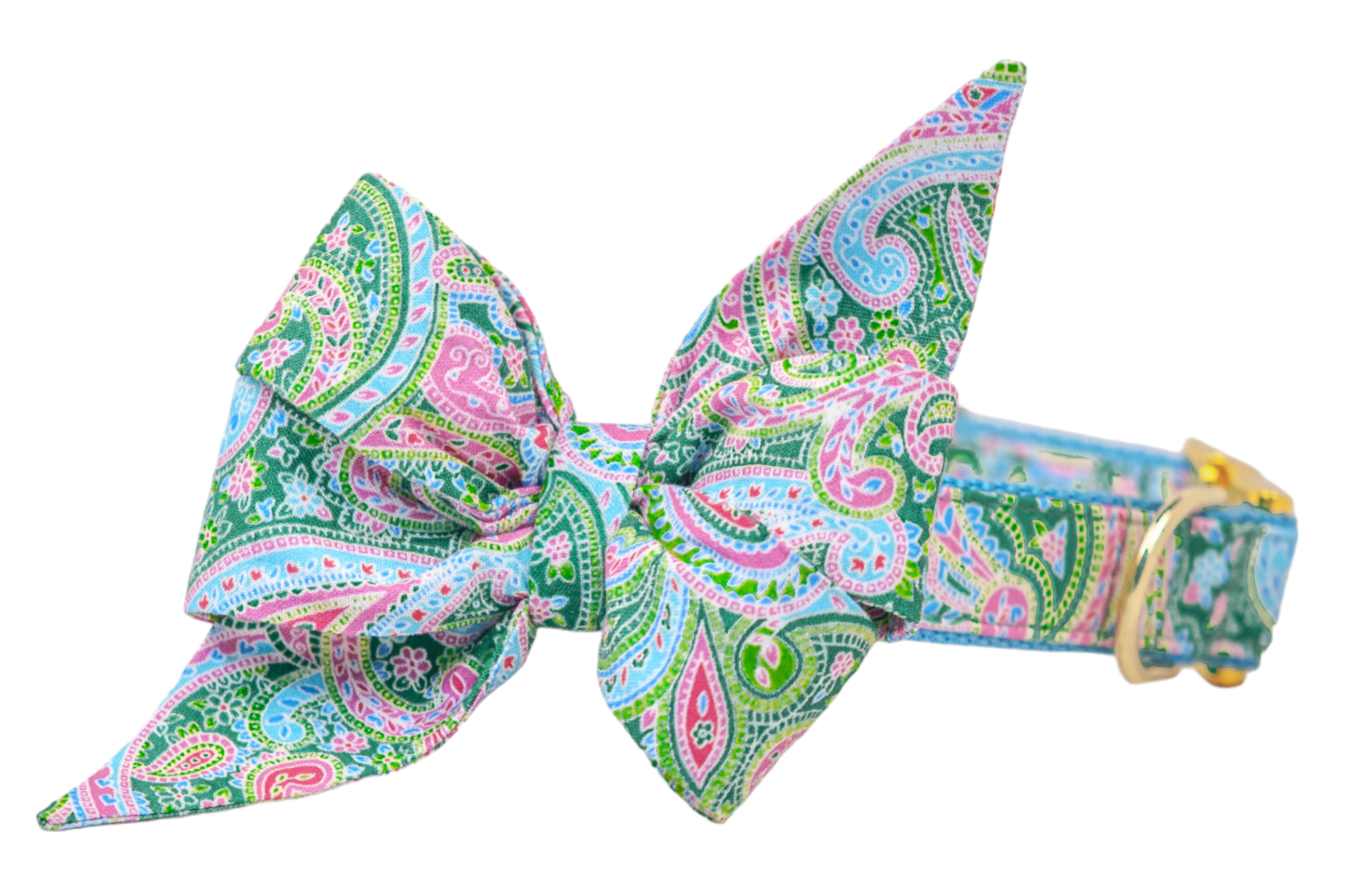 A vibrant dog collar with an oversized feminine belle bow featuring a colorful paisley pattern in shades of green, pink, blue, and white. The fabric belle bow has exaggerated, pointed ends and is attached to a matching collar with gold hardware.