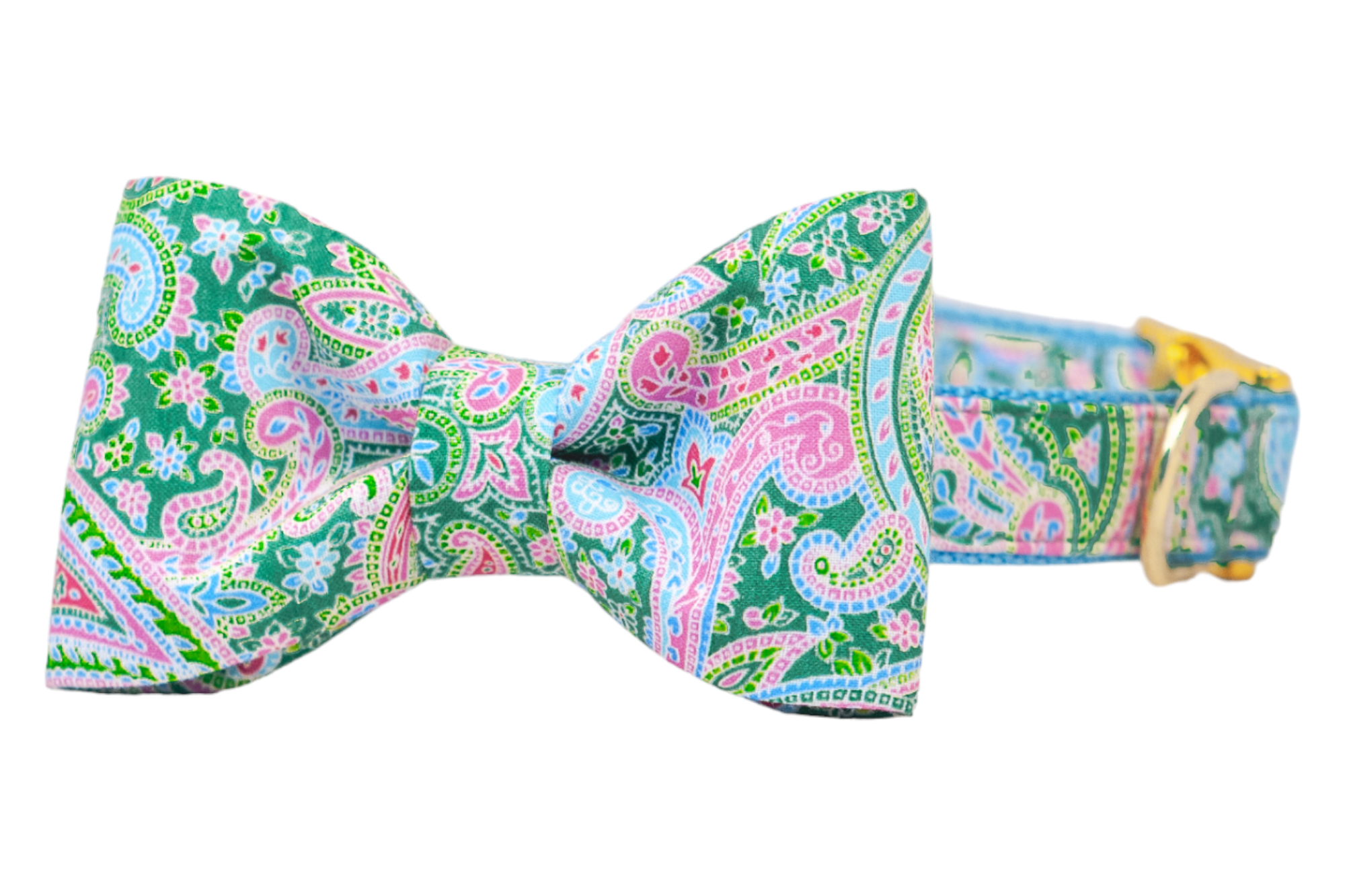 A colorful dog collar with a classic bow tie in a vibrant paisley print. The design features swirling patterns in green, pink, and blue, accented with floral motifs, and includes gold hardware for a polished finish.