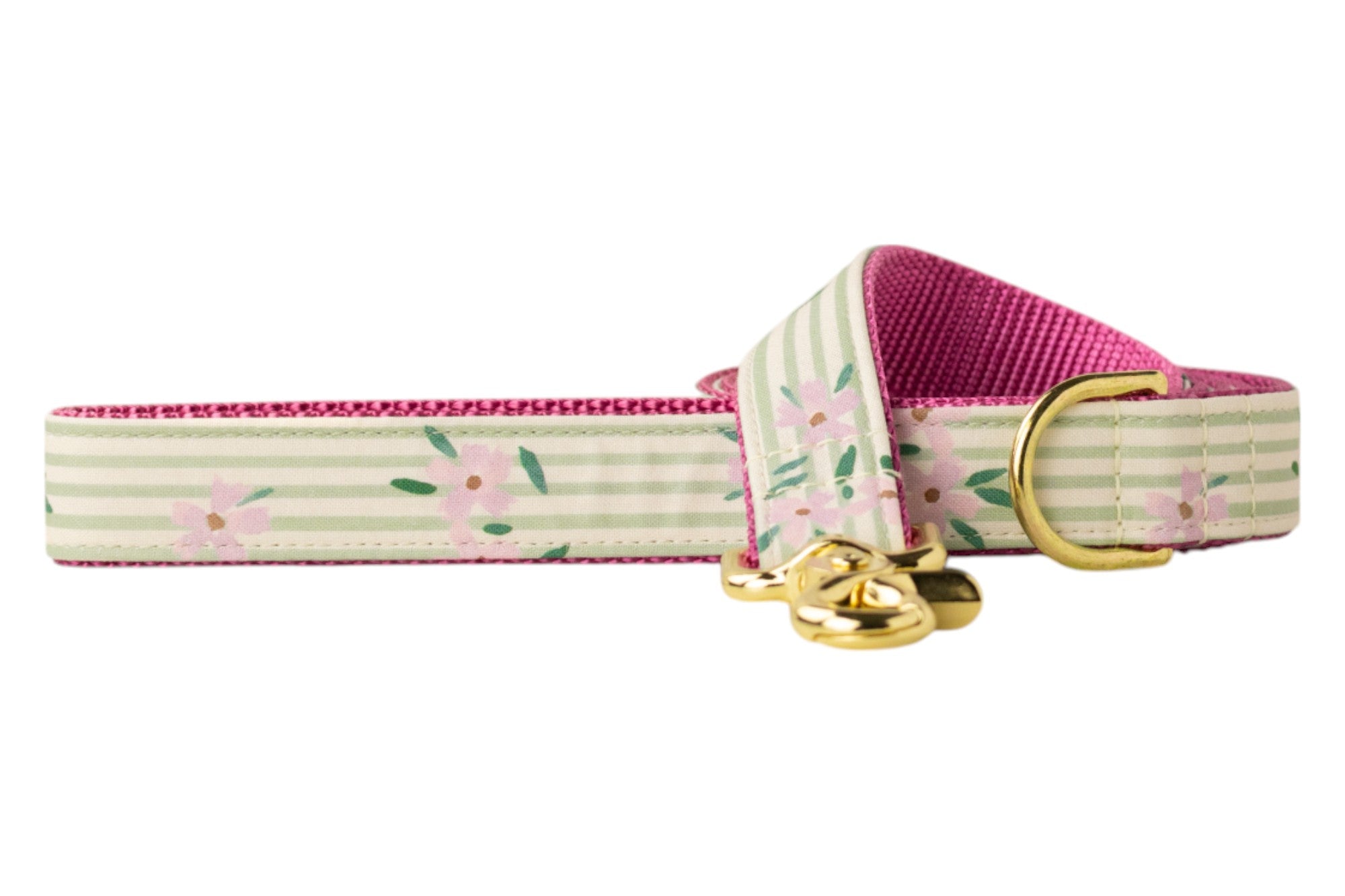 Striped dog collar in soft green tones, accented by delicate pink floral prints. The inner lining is bright pink, and the collar includes shiny gold hardware.
