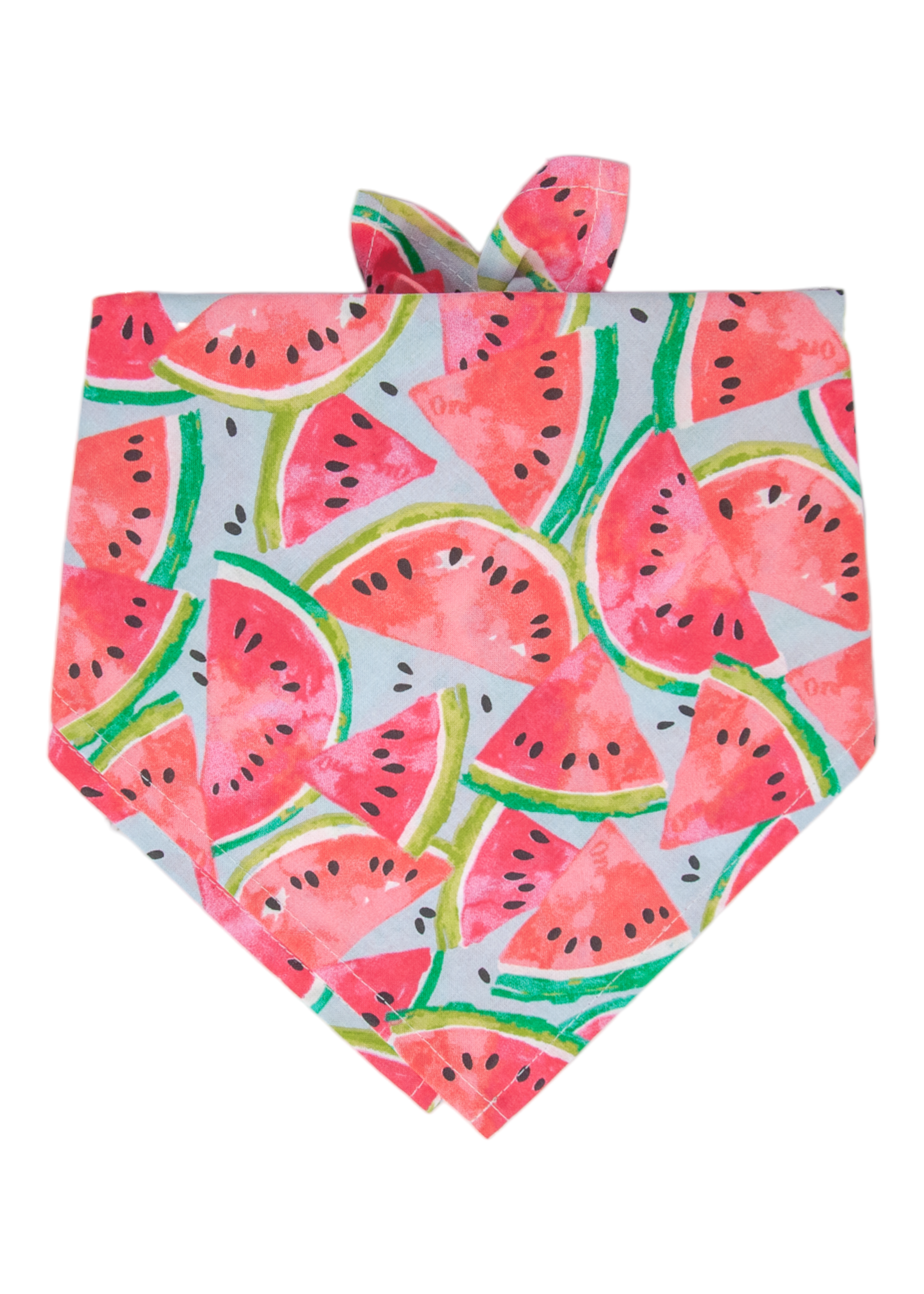 A colorful watermelon-themed bandana for dogs, decorated with scattered slices of red-pink fruit, green rinds, and black seeds. The fabric is shaped into a pointed triangle and tied at the top, offering a cheerful and summery look for your pup!