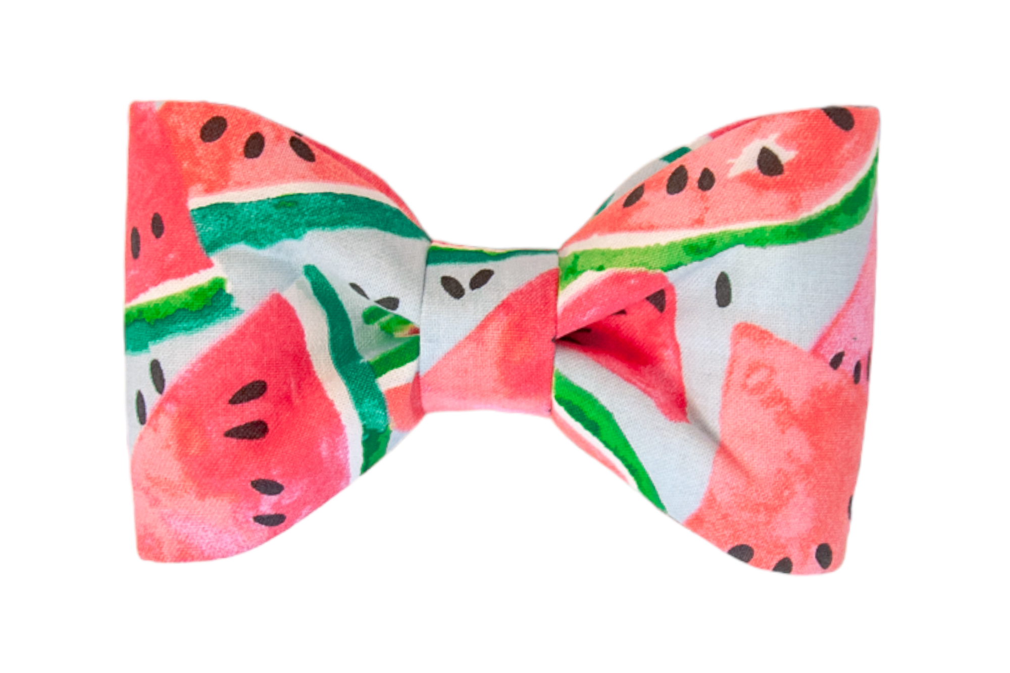 A symmetrical fabric dog bow tie featuring a vibrant watermelon pattern with pink-red fruit slices, green-striped rinds, and scattered black seeds. The background is a soft pale blue, and the bow is neatly cinched at the center, creating a bright, summer-themed accessory.