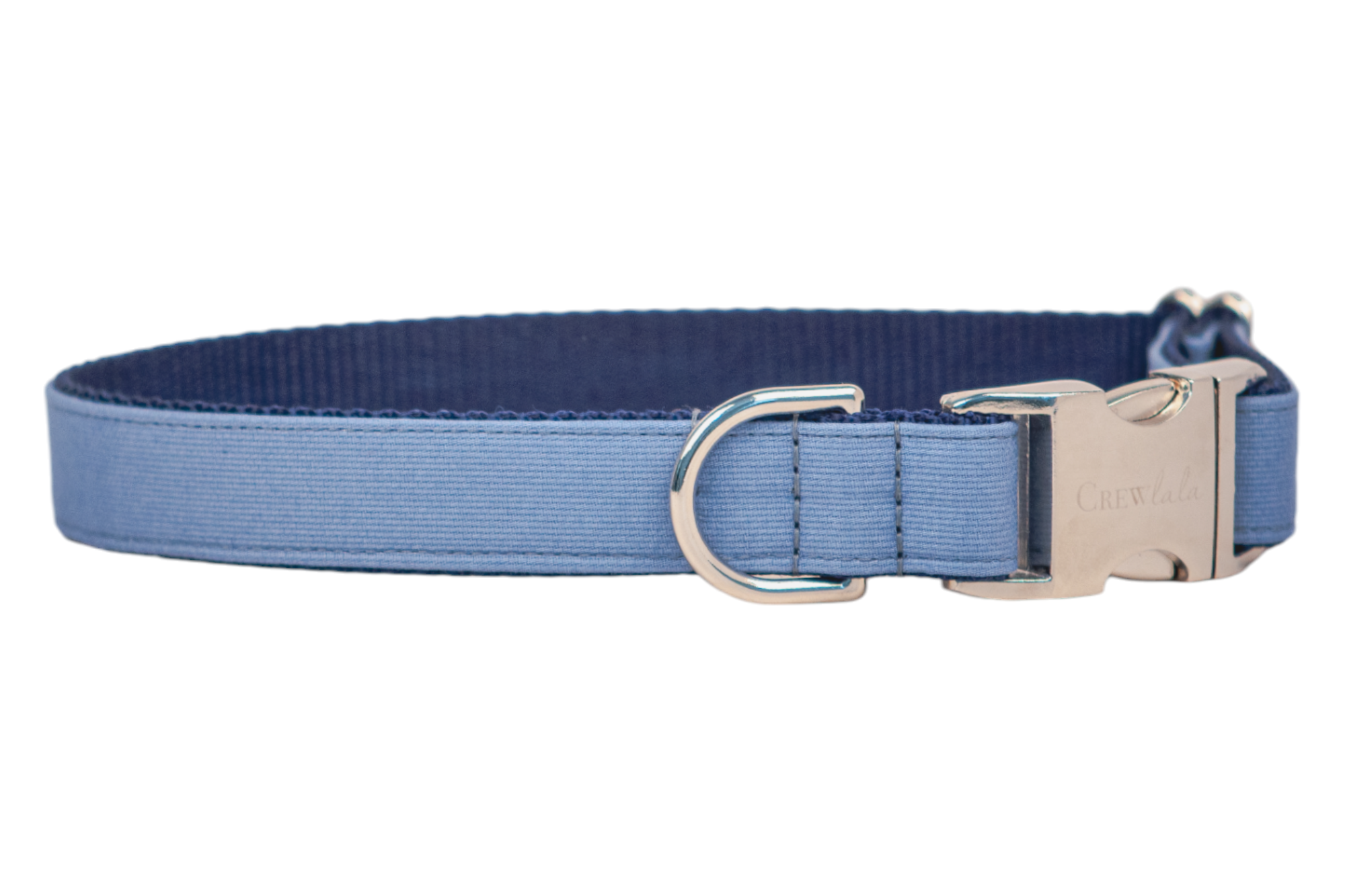 A slate blue dog collar made from ribbed fabric with a navy blue webbing interior. The collar features polished silver-tone hardware, including a D-ring and a side-release buckle engraved with the brand name "Crew LaLa." It has clean stitching and an adjustable fit for comfort and durability.