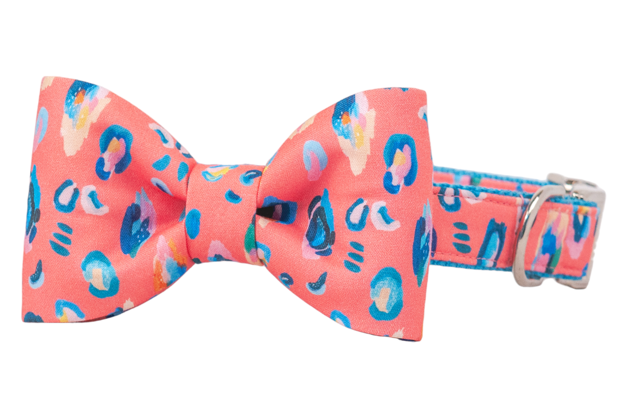 A bold coral dog collar featuring a classic and matching bow tie with colorful leopard-style spots and sleek silver hardware — perfect for stylish walks or special events.