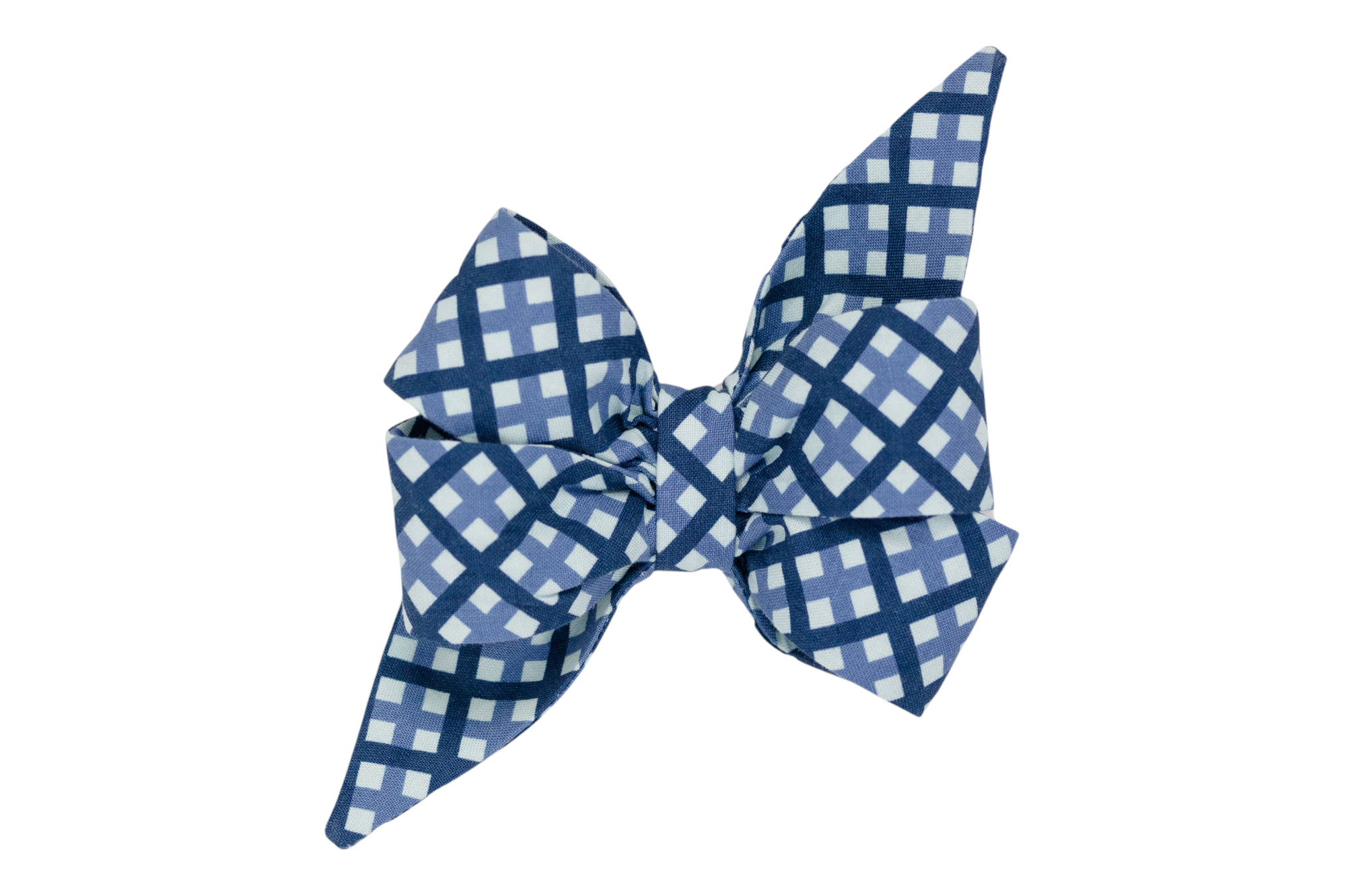 A handmade girl dog belle bow featuring a classic windowpane plaid pattern in shades of blue.