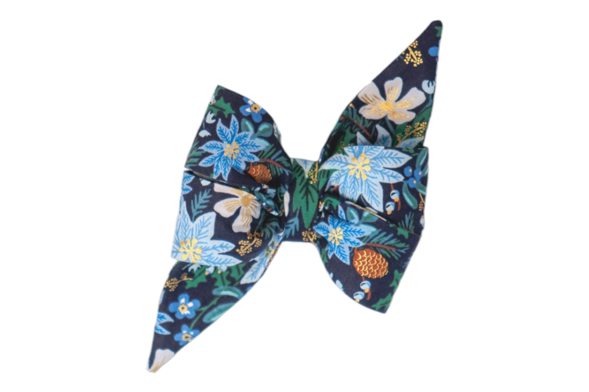 Winter-themed dog bow tie with elongated, pointed ends and a festive print on navy fabric. The design showcases blue poinsettias, pine branches, pinecones, and light colored flowers, highlighted with sparkling metallic accents for a festive, chic, seasonal look.