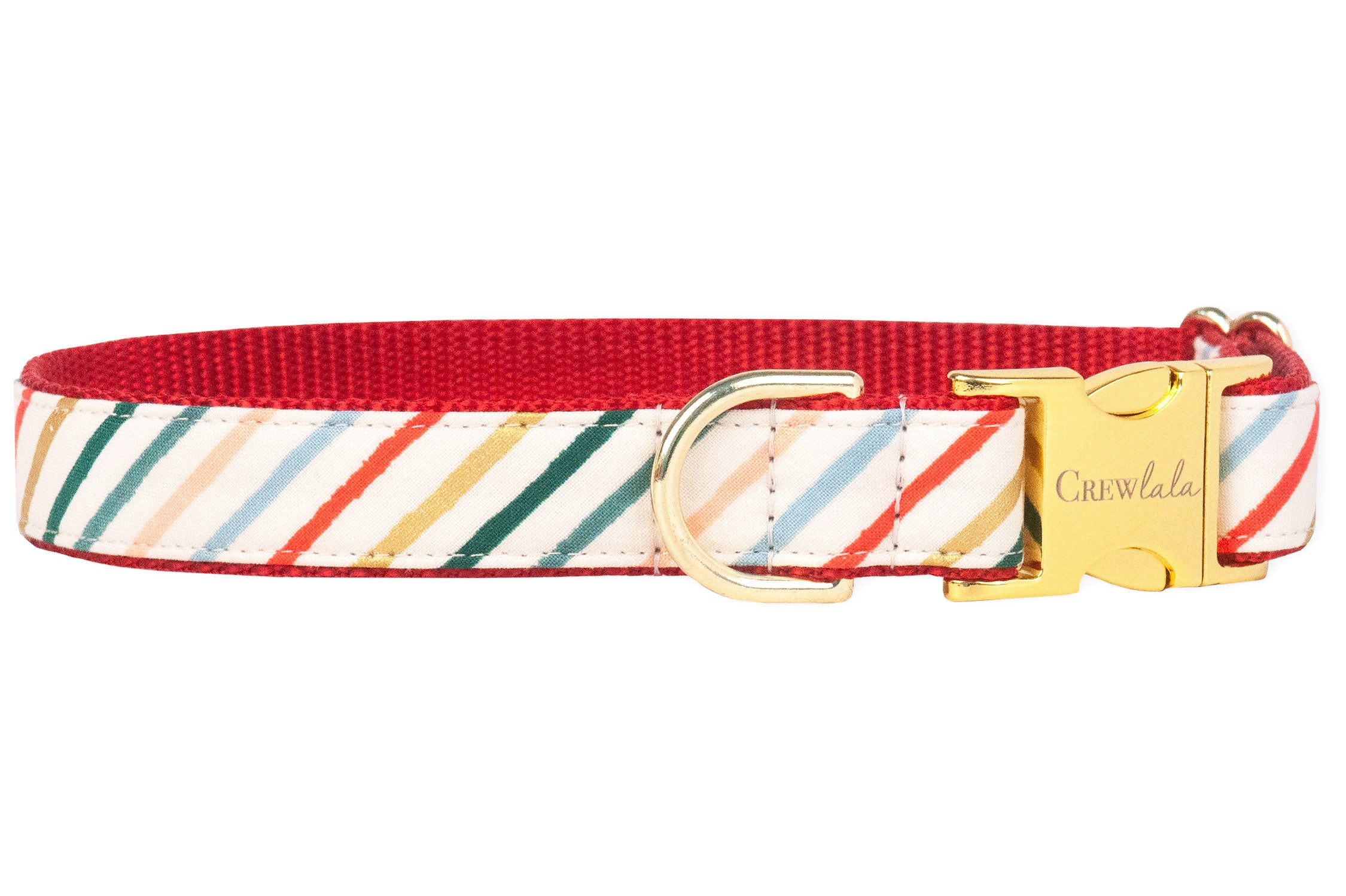 A festive dog collar with diagonal holiday stripes in red, green, gold, blush, and light blue on a cream background. The collar is finished with a bright red backing and shiny gold hardware.