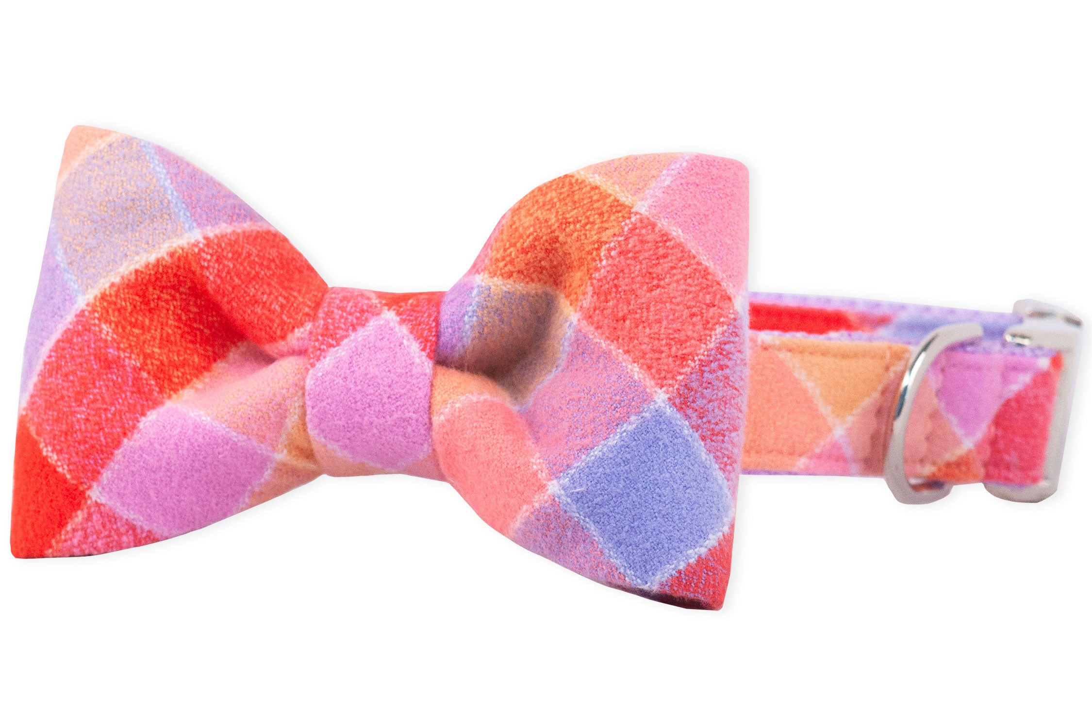 Dog collar with an attached matching bow tie in a soft flannel fabric, featuring a colorful plaid pattern. The collar has a metal buckle and a polished D-ring.