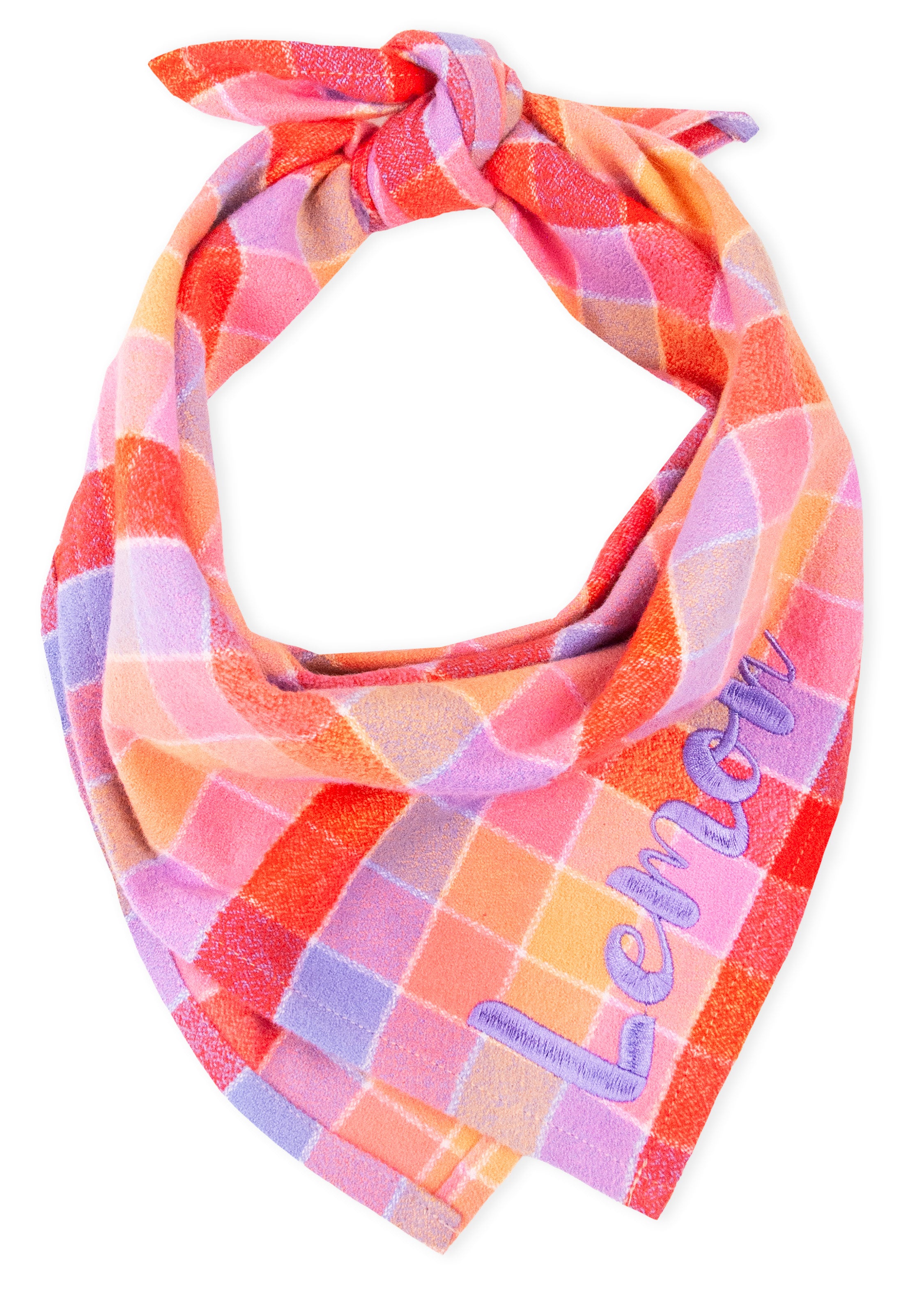 Vibrant dog bandana with a cozy flannel texture and bold plaid design. Tied at the top, the bandana is personalized with the name “Lemon” embroidered diagonally in light thread on the front corner.