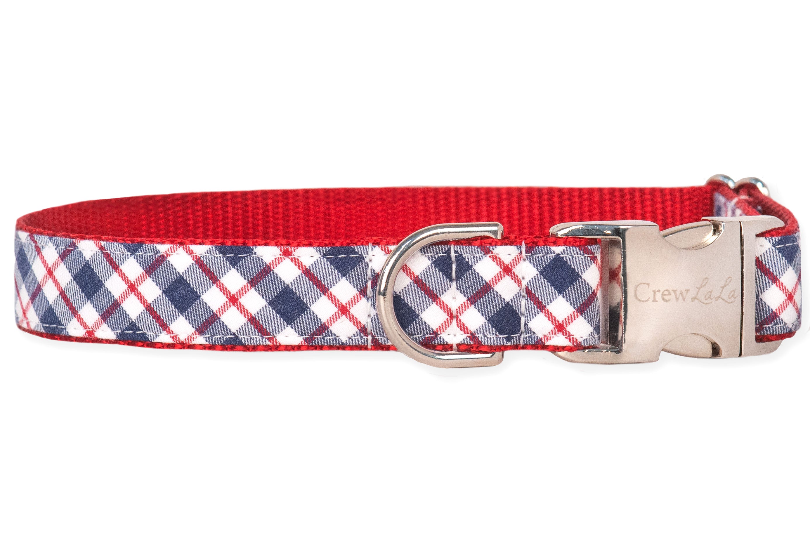 A stylish dog collar with a patriotic plaid design in navy, red, and white, finished with red webbing on the inside. It has a polished silver metal buckle engraved with “Crew LaLa” and a matching D-ring for functionality.