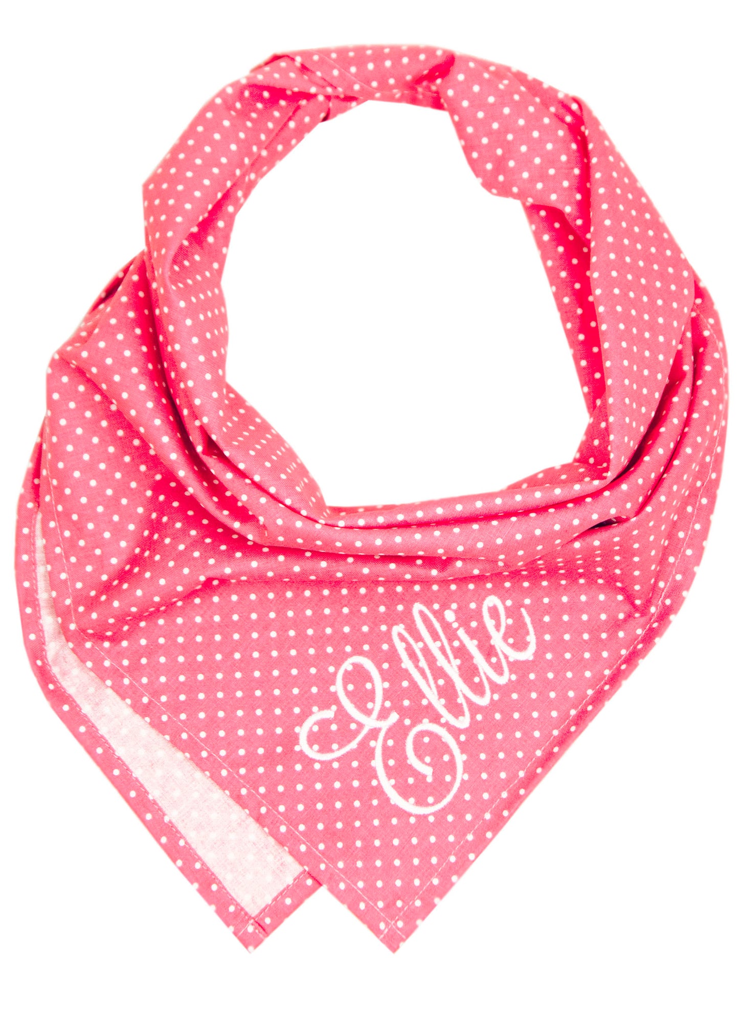 Personalized pink polka dot dog bandana featuring soft white dots and the name “Ellie” stitched in elegant script, styled in a classic triangular fold.