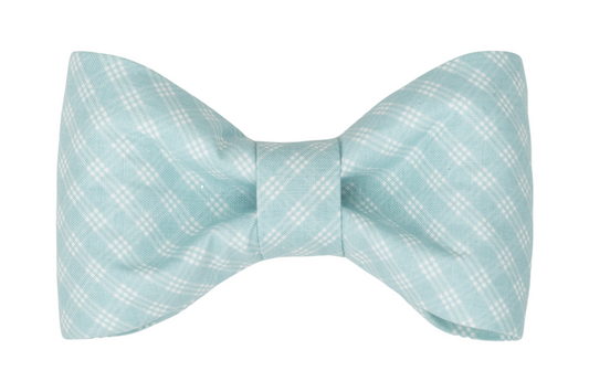 Handmade dog bow tie in a soft aqua blue color with a white plaid pattern, creating a clean and classic look.