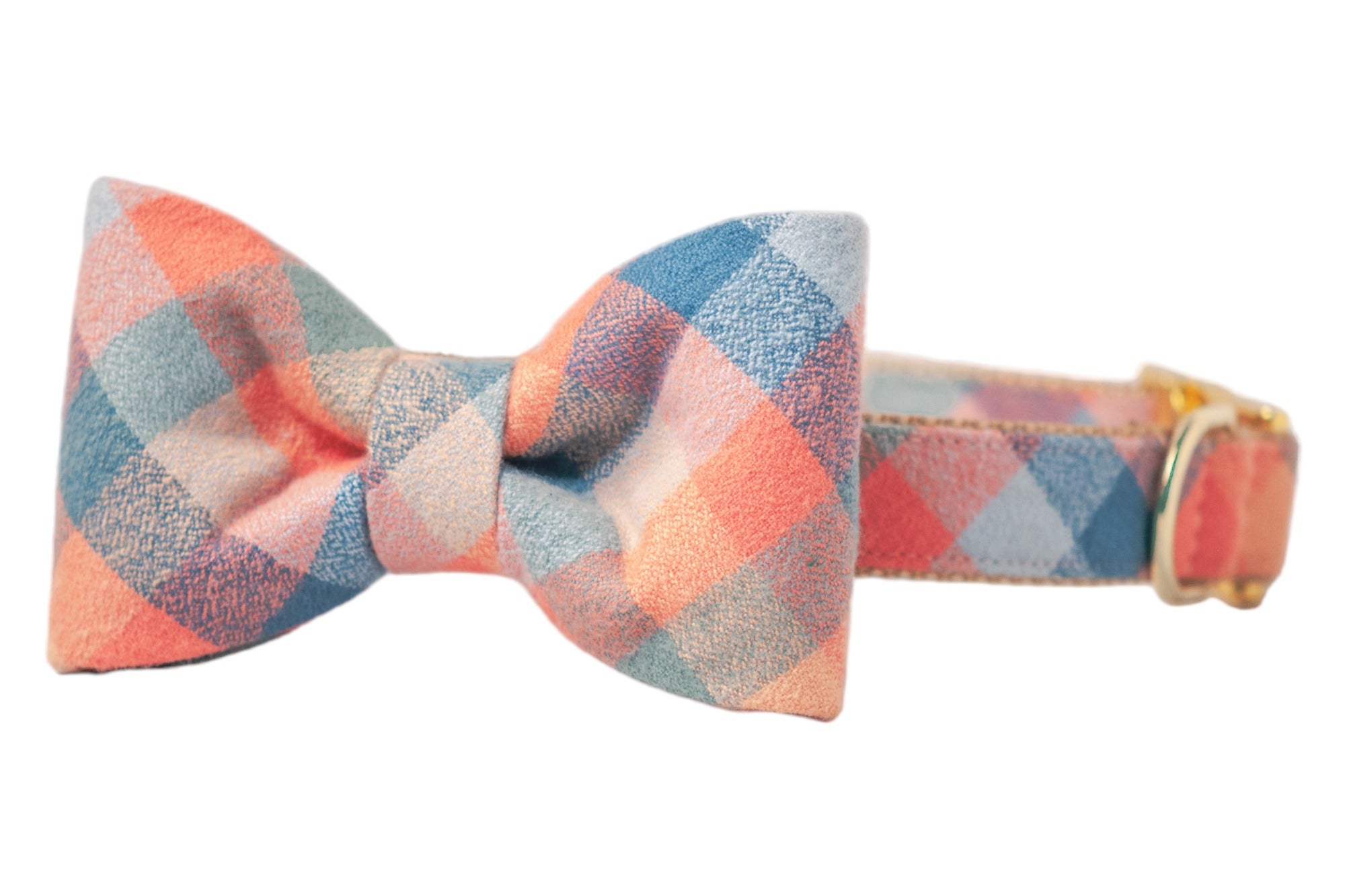 Adjustable dog collar with an attached bow tie, both covered plaid flannel fabric in muted tones, featuring hardware for size adjustment. The perfect accessory for fall!