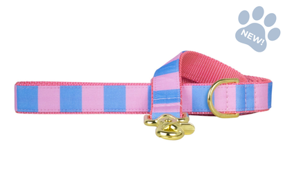 Striped pet leash in pastel pink and blue, designed with durable webbing, a gold swivel clasp, and coordinating gold D-ring hardware for a polished look.
