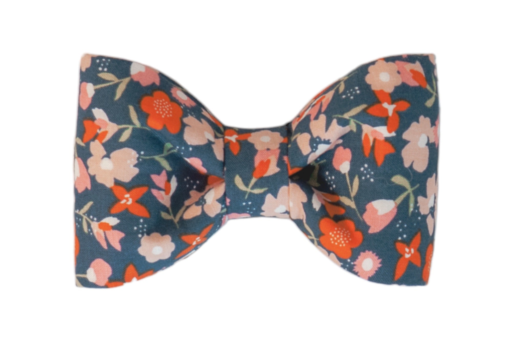 Charming Fall inspired dog bow tie with a floral pattern in vibrant coral, blush, and ivory against a deep teal background.