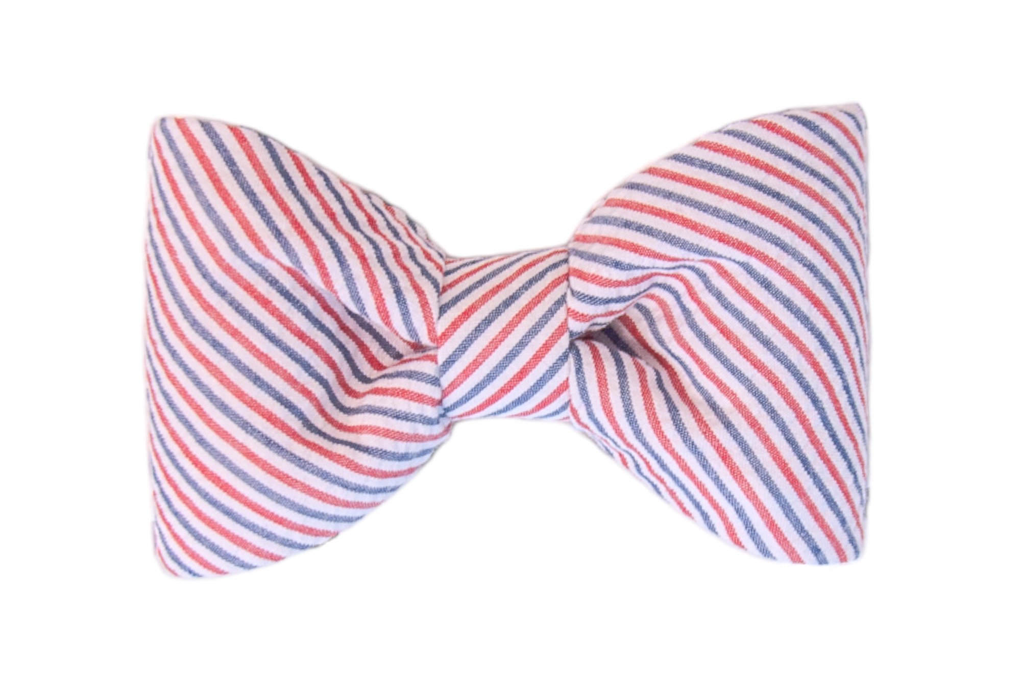 Classic-style dog bow tie made of lightweight seersucker fabric with red and navy blue diagonal stripes on white, shaped with gently puffed sides and a cinched center.