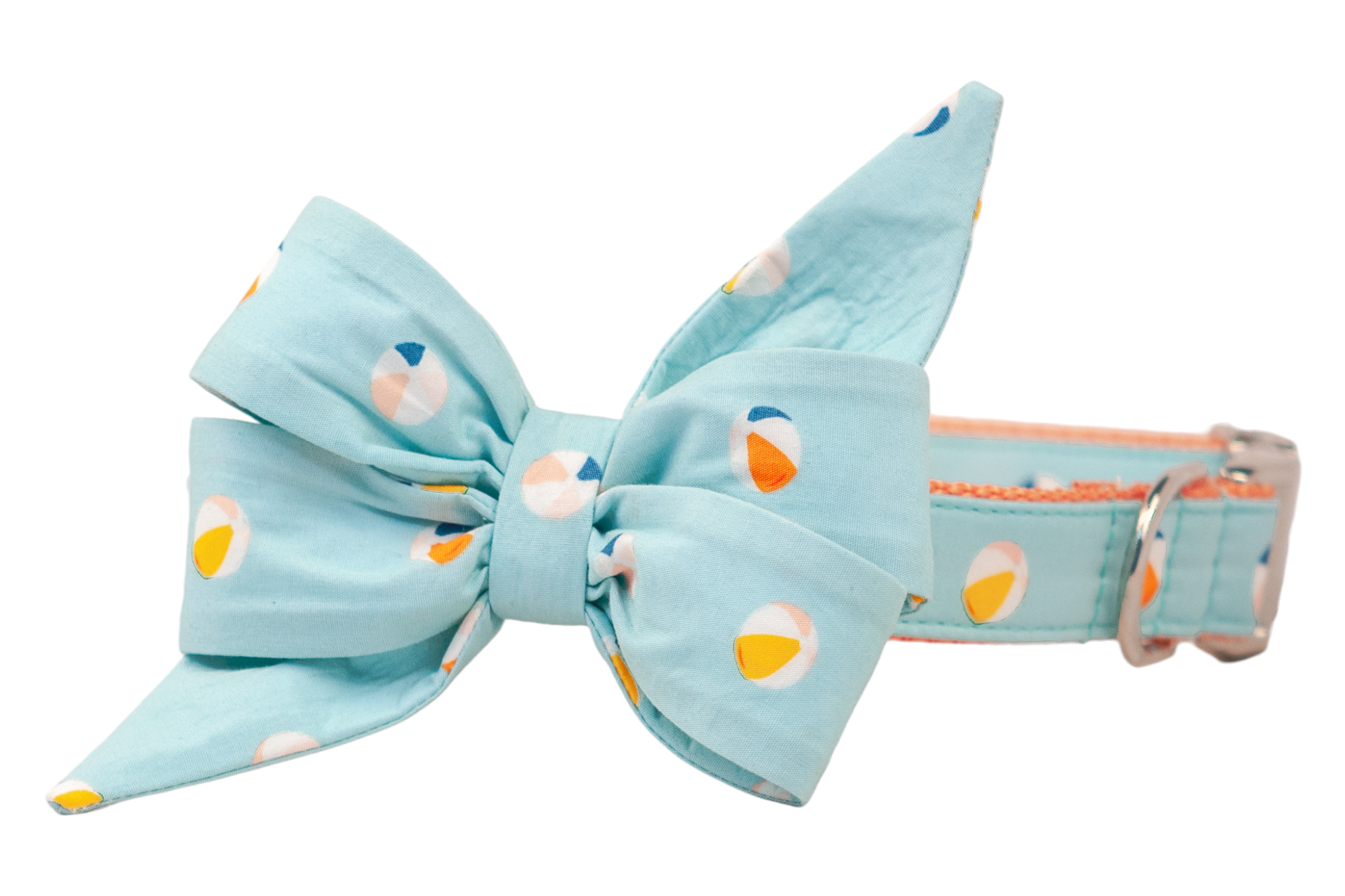 A light blue dog collar for your favorite gall with an oversized fabric belle bow, both printed with a repeating beach ball pattern in orange, yellow, peach, and navy. The bow has wide, full loops and long pointed tails, while the collar is finished with silver hardware.