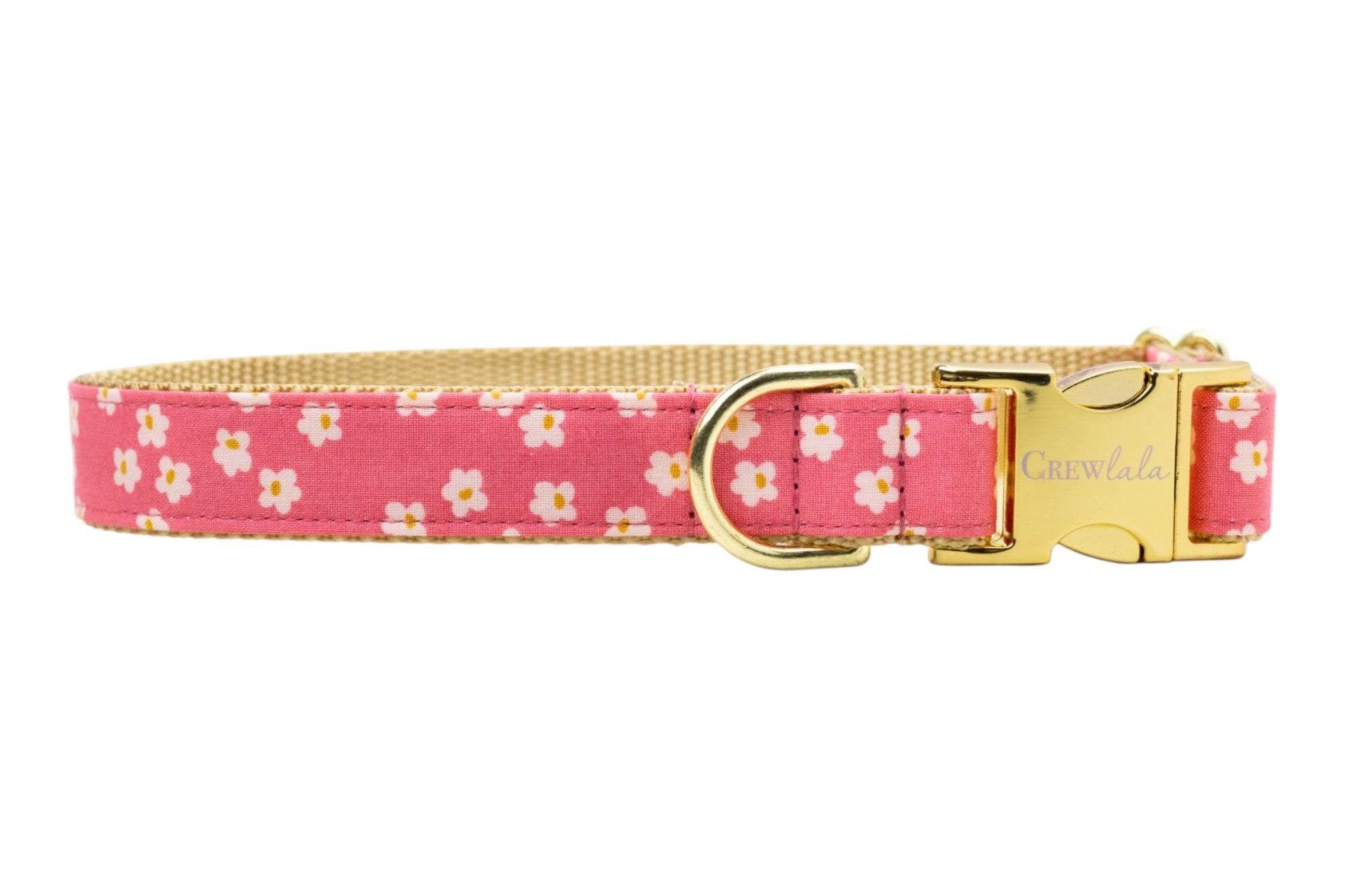 Close-up of a pink daisy-print pet collar with a sturdy gold clasp and D-ring, showcasing a decorative yet durable design by Crewlala.