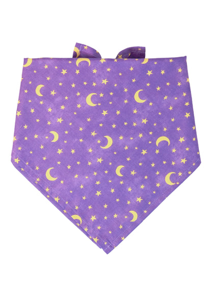 Vibrant purple dog bandana with a scattered pattern of stars and crescent moons. Folded in a classic triangle shape with tie ends at the top, this magical accessory adds a touch of cosmic charm—perfect for Halloween costumes or mystical photo shoots.