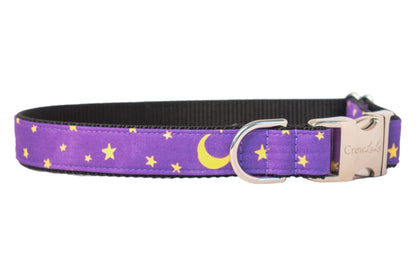 Purple dog collar with a night sky design featuring bright stars and crescent moons, paired with polished hardware and a sleek nylon webbing lining. This dreamy, magical accessory is perfect for dogs celebrating Halloween or just looking stylish under the moonlight.