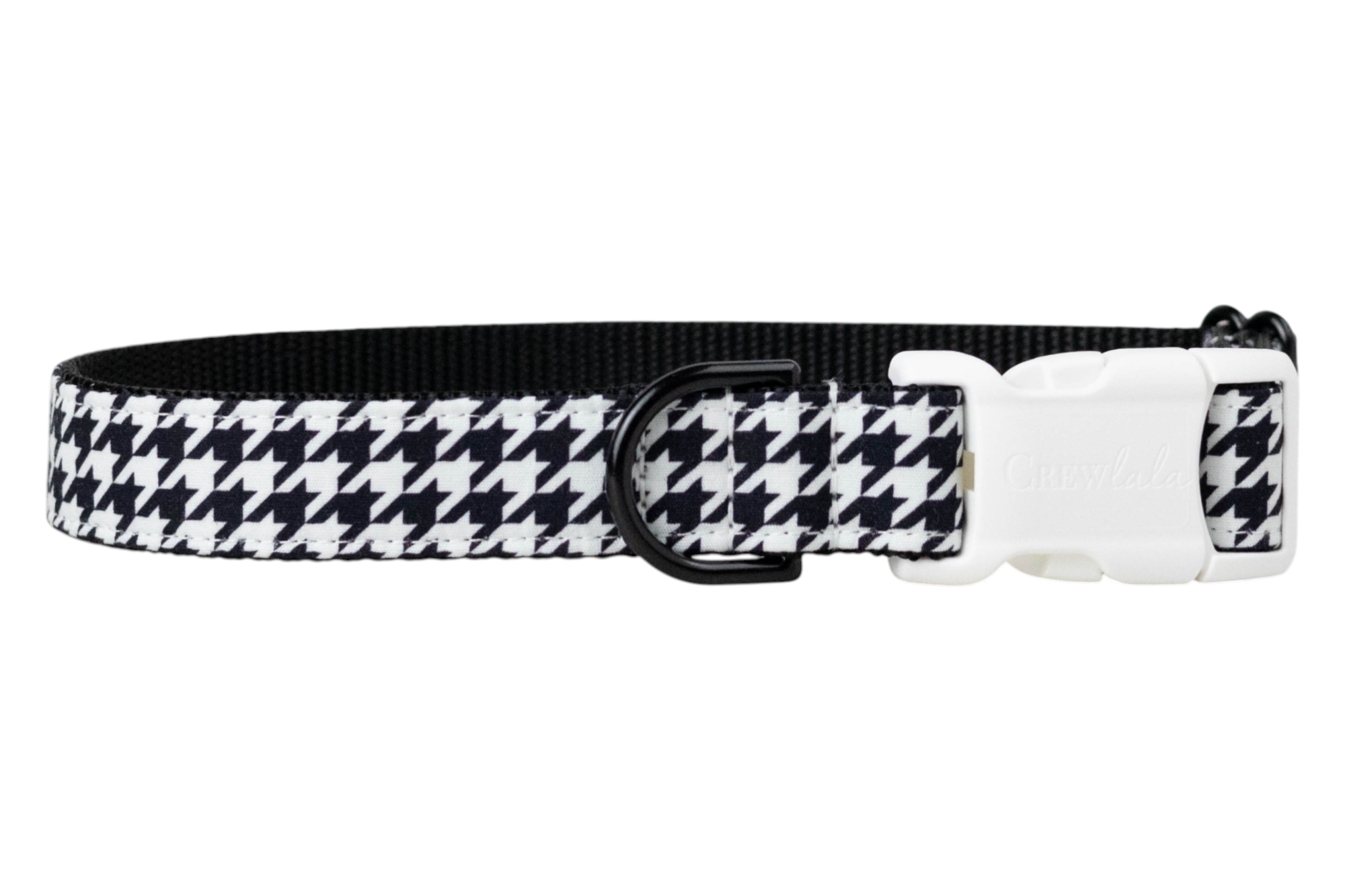 A dog collar with a classic black and white houndstooth pattern on the outer band and a solid black woven interior. The collar features a white plastic side-release buckle engraved with the brand “Crew LaLa” and a black D-ring for leash attachment.
