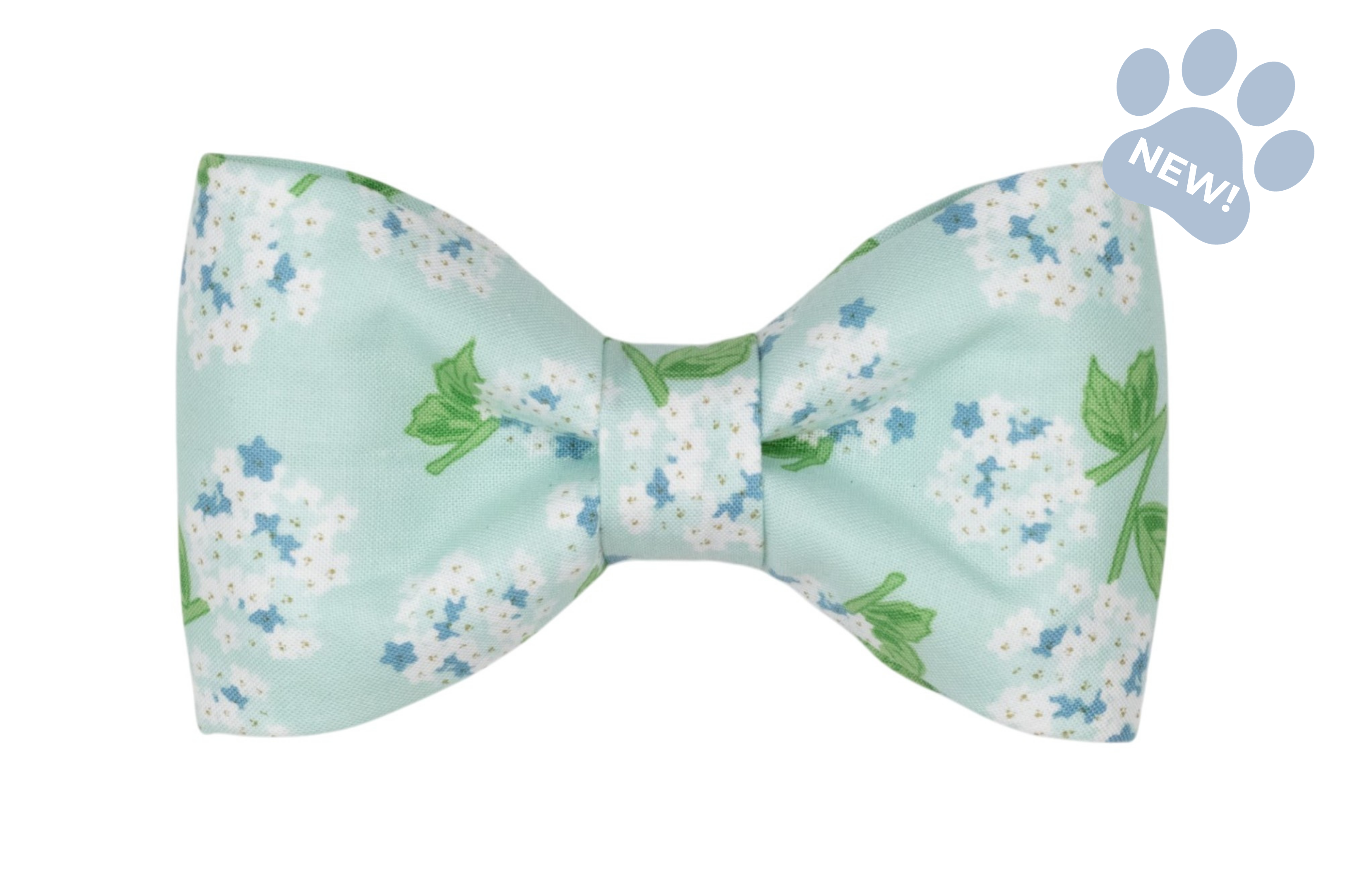 Hydrangea-print dog bow tie featuring a soft mint blue background with white hydrangea blooms, blue floral accents, and green leaves, styled in a classic bow shape.