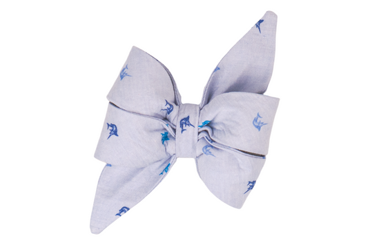Your pup will be ready for summer in this ocean-inspired girl dog belle bow featuring delicate marlin fish pattern on a soft blue fabric. 