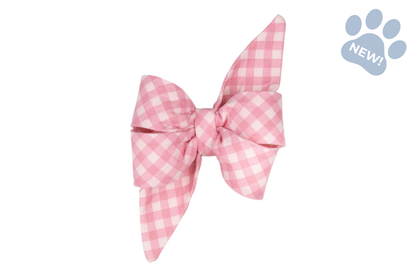 Oversized dog collar bow in a pastel pink and white gingham print, styled with signature belle bow loops and elongated pointed tails for an elegant look.