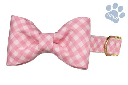 Dog collar with a pink-and-white gingham bow tie, paired with a coordinating adjustable collar and gold-colored metal hardware.